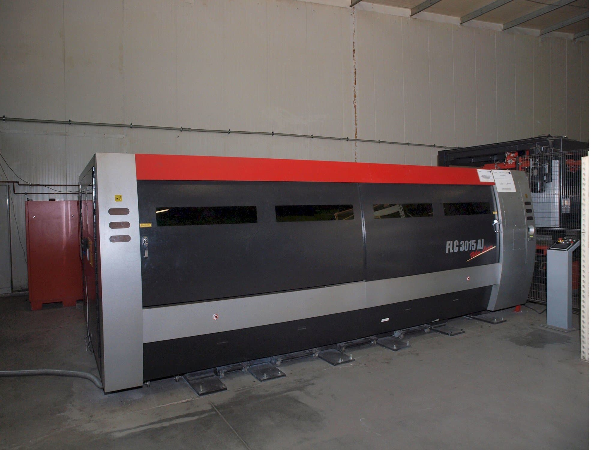 Front view of AMADA LC-3015 AJ 2kW Fiber laser machine