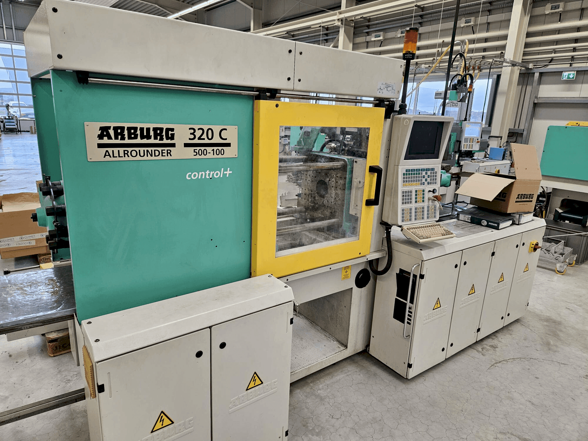 Front view of Arburg 320 C 500-100 + Multilift H with B-Axis  machine