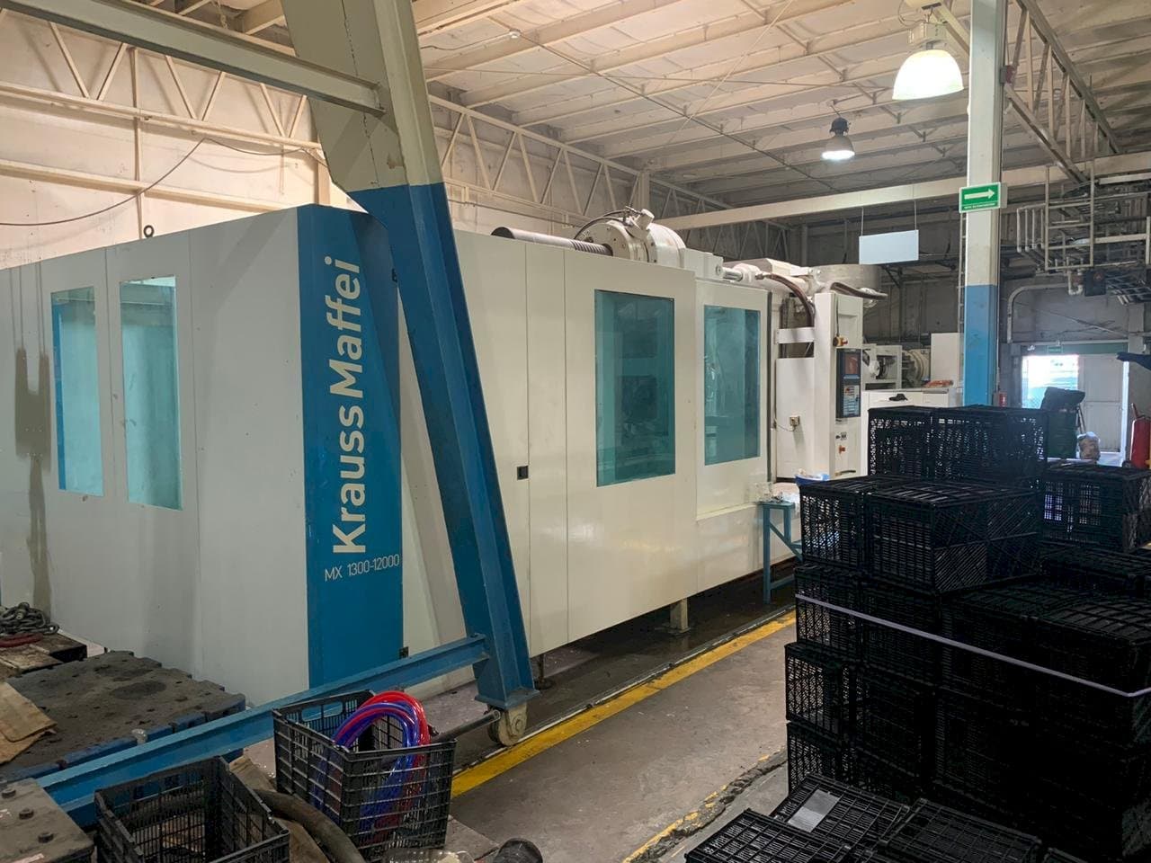 Front view of Krauss Maffei 1300-12000 MX machine
