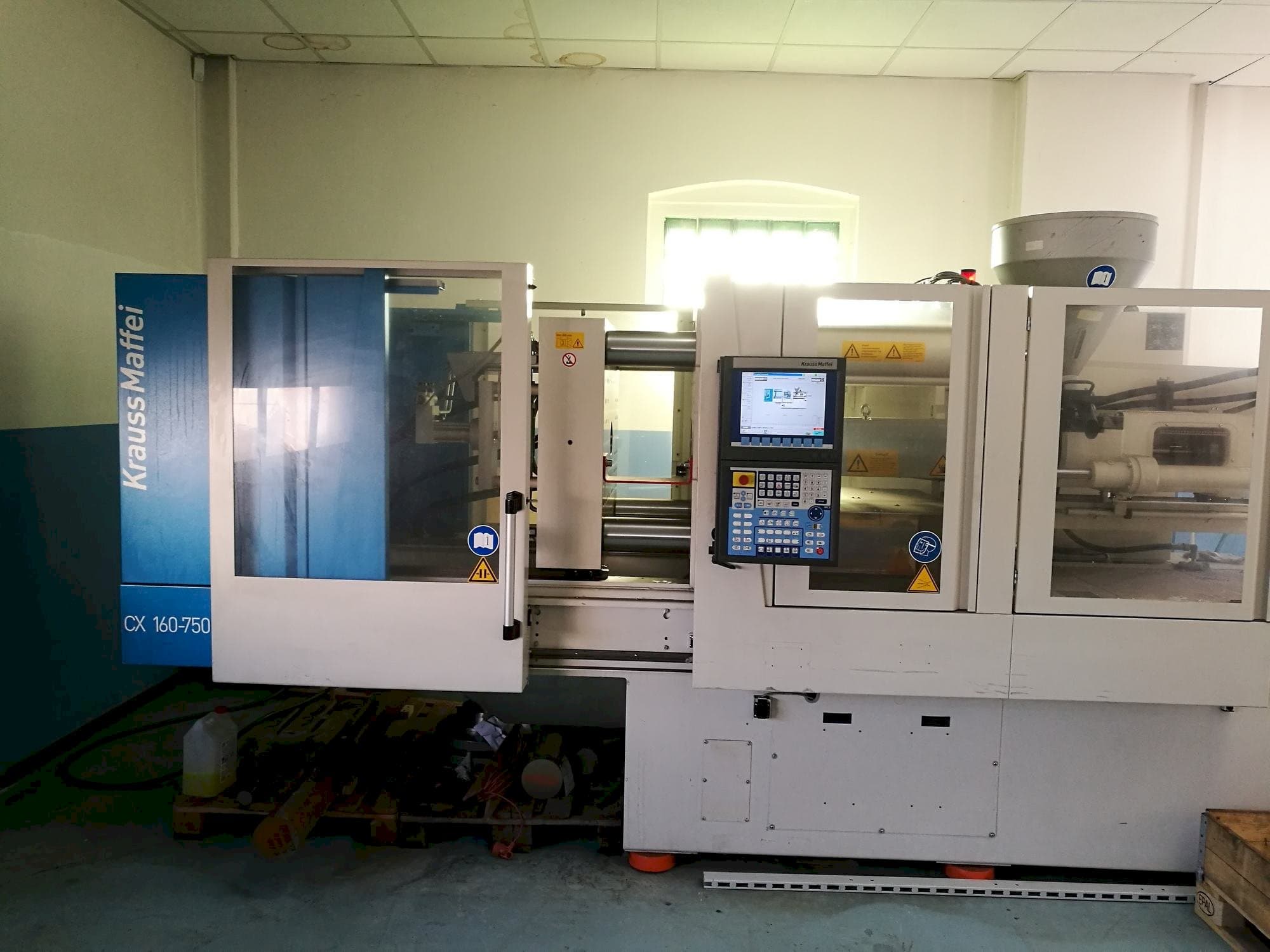 Front view of Krauss Maffei KM 160-750 CX machine