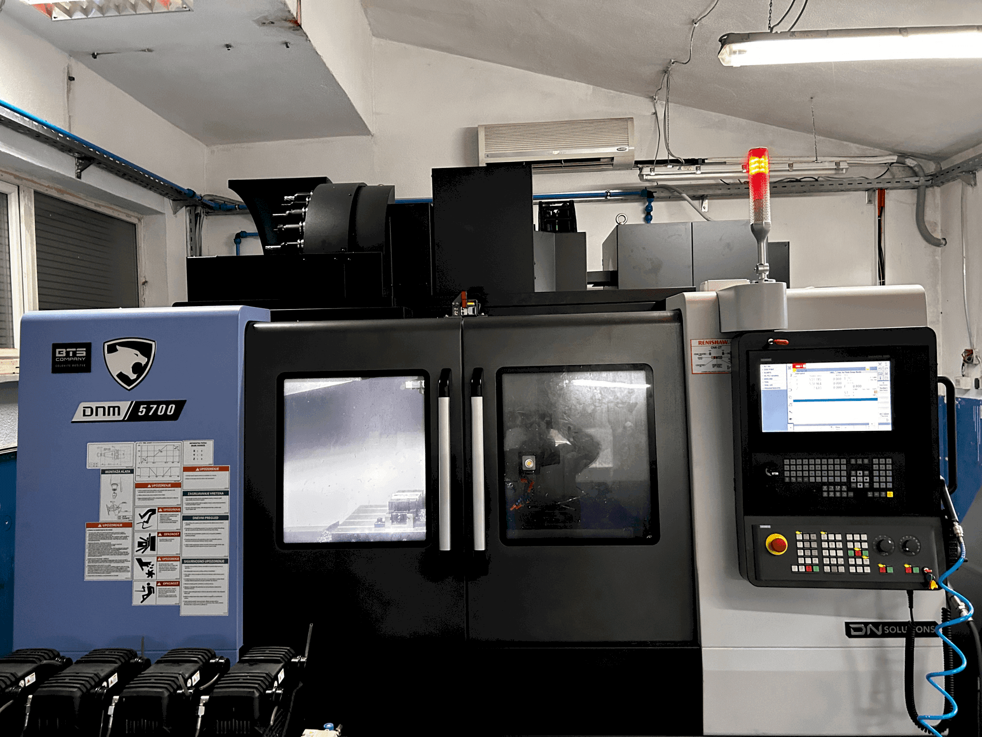 Front view of DN SOLUTIONS DNM 5700 machine