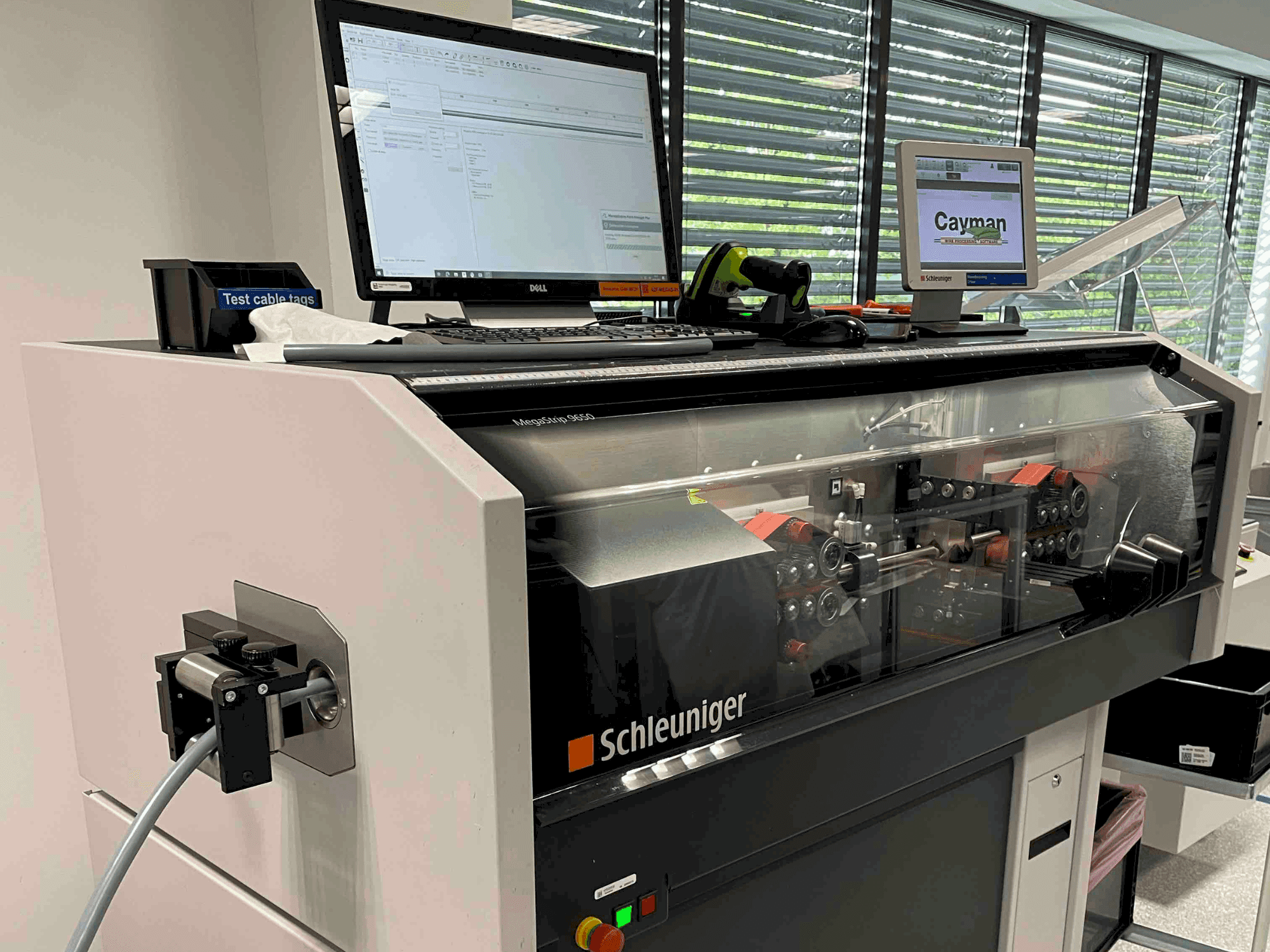 Front view of Schleuniger MegaStrip 9650 machine