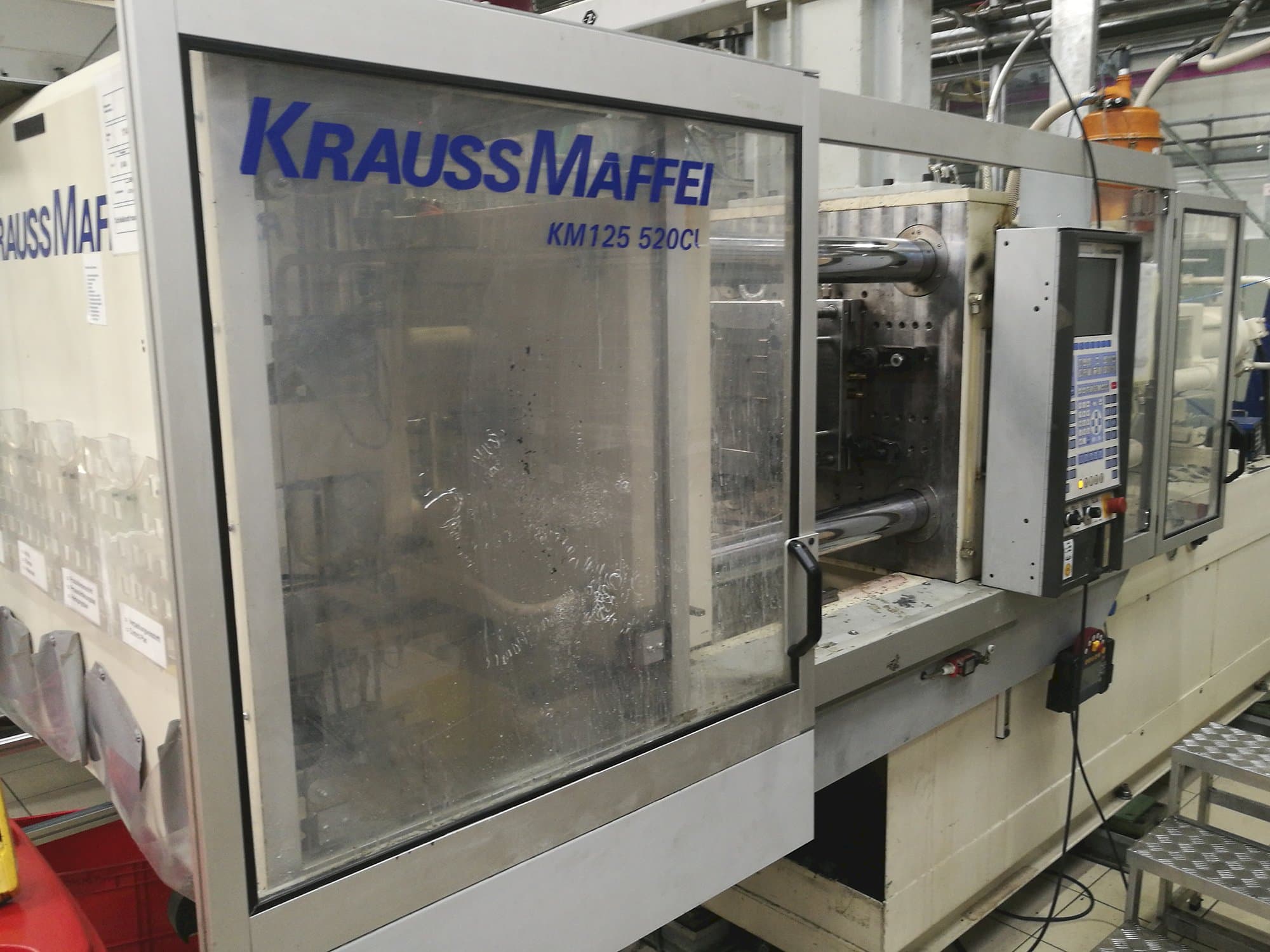 Front view of Krauss Maffei KM 125-520 C1 Machine