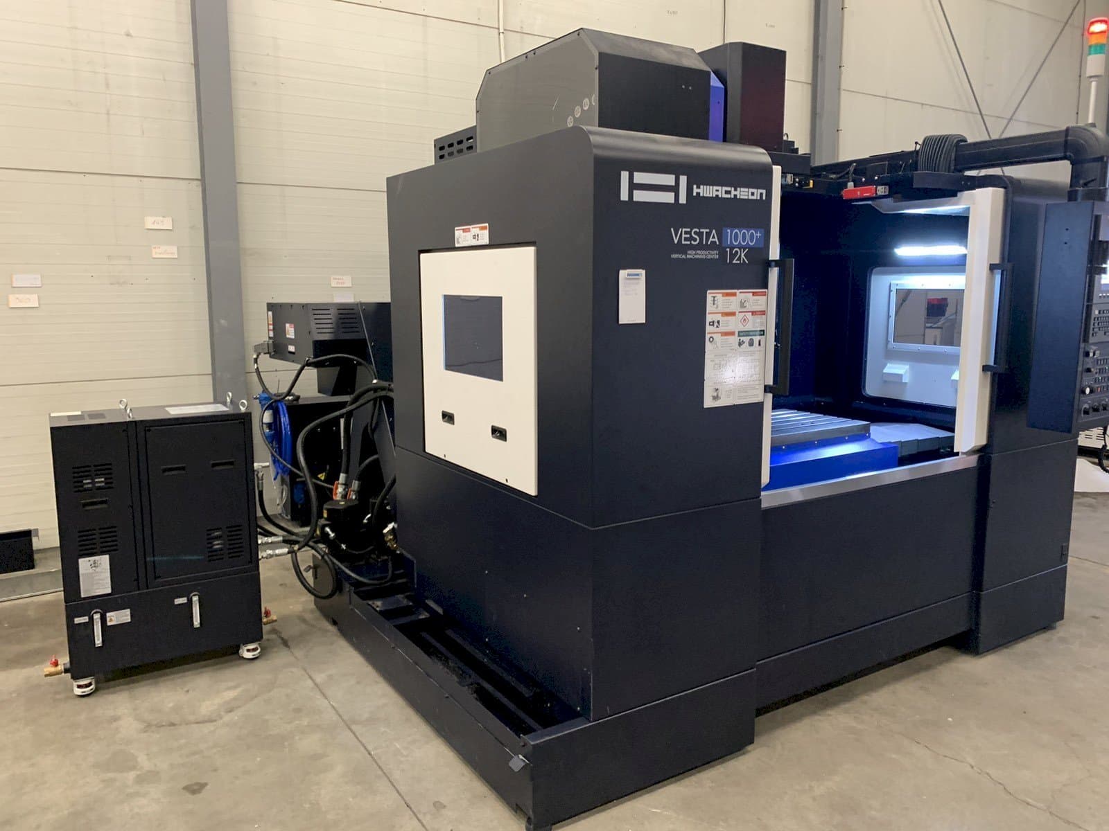 Front view of HWACHEON VESTA-1000+ machine