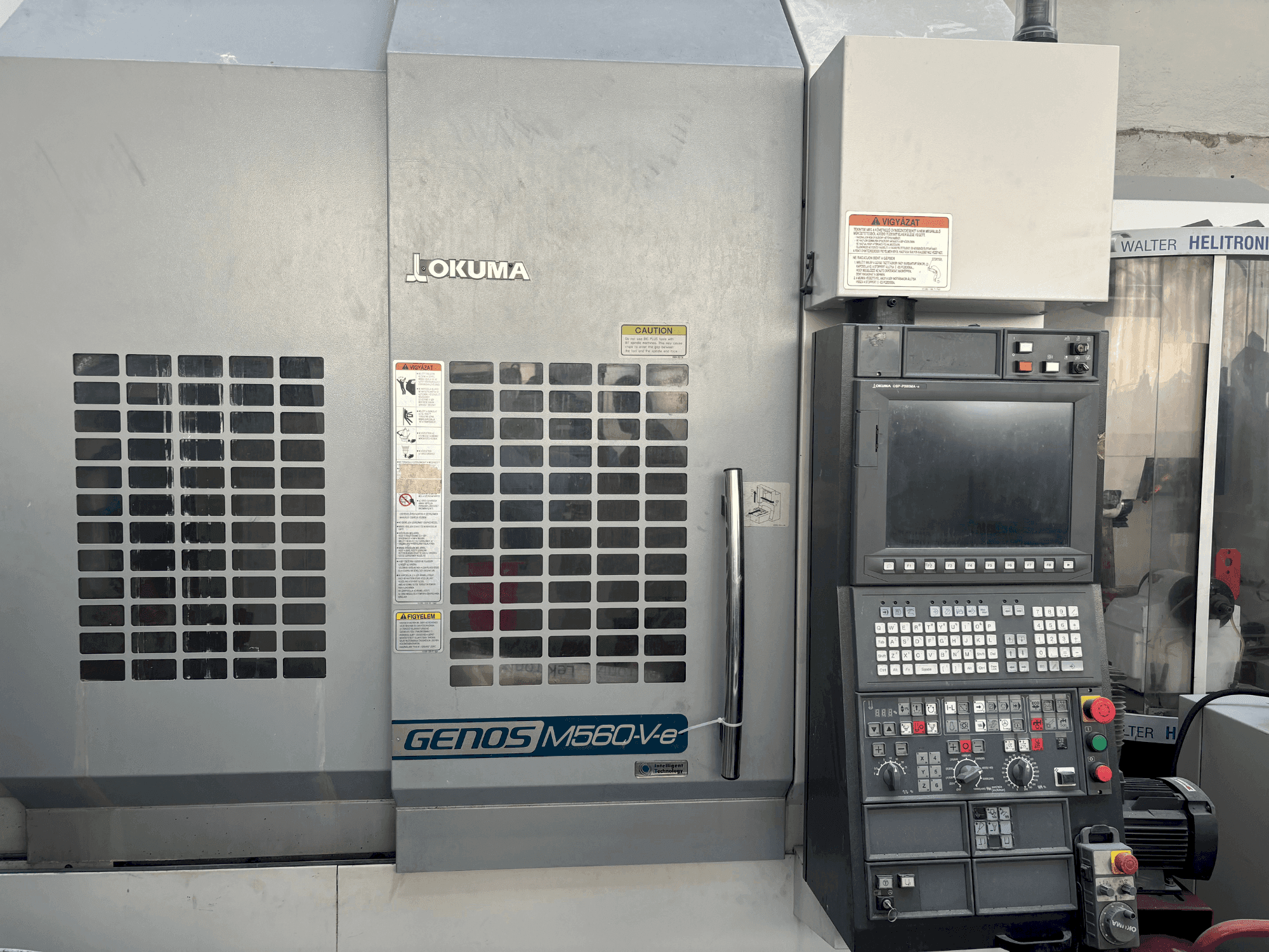 Front view of Okuma Genos M56-V-e machine