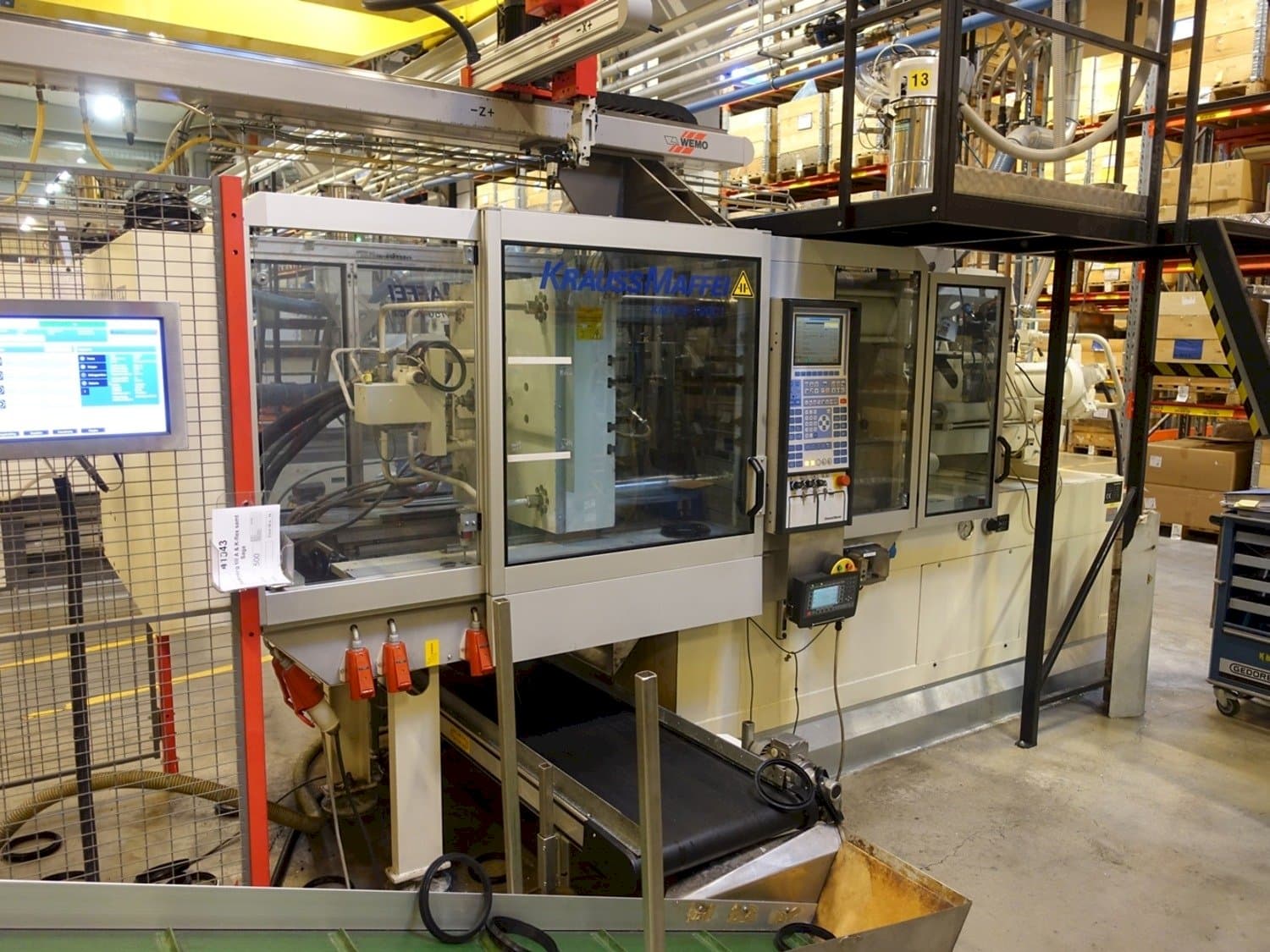 Front view of Krauss Maffei KM 150-700 C1 machine