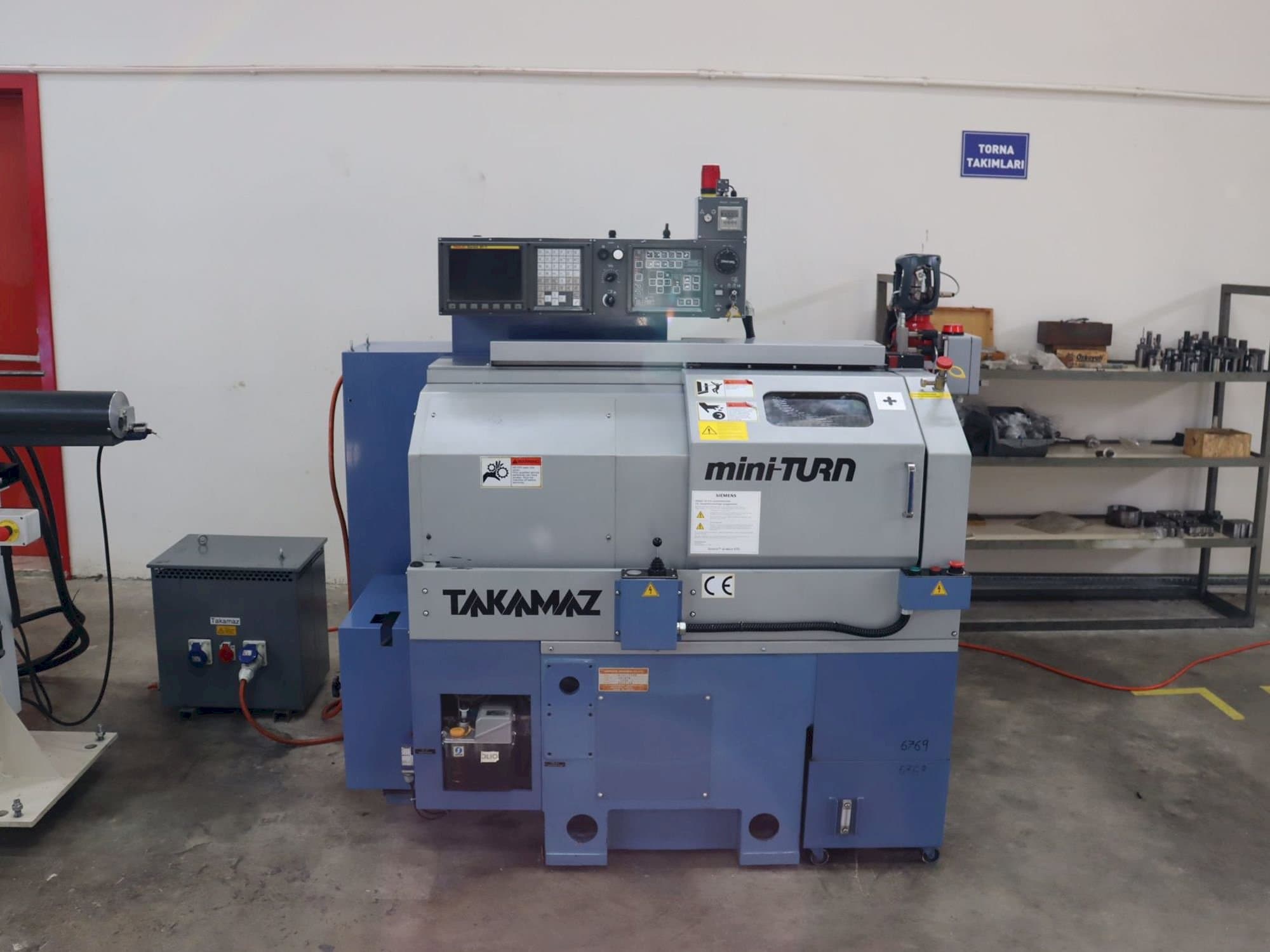 Front view of Takamaz mini-TURN machine