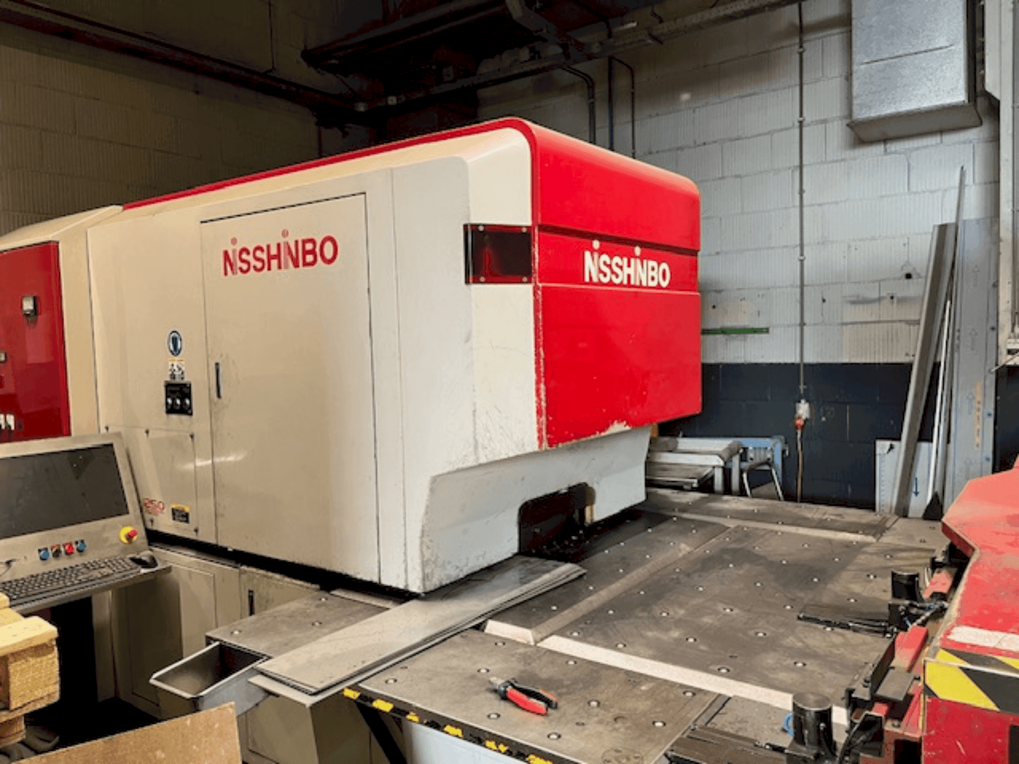 Front view of Nisshinbo HIQ-1250 machine