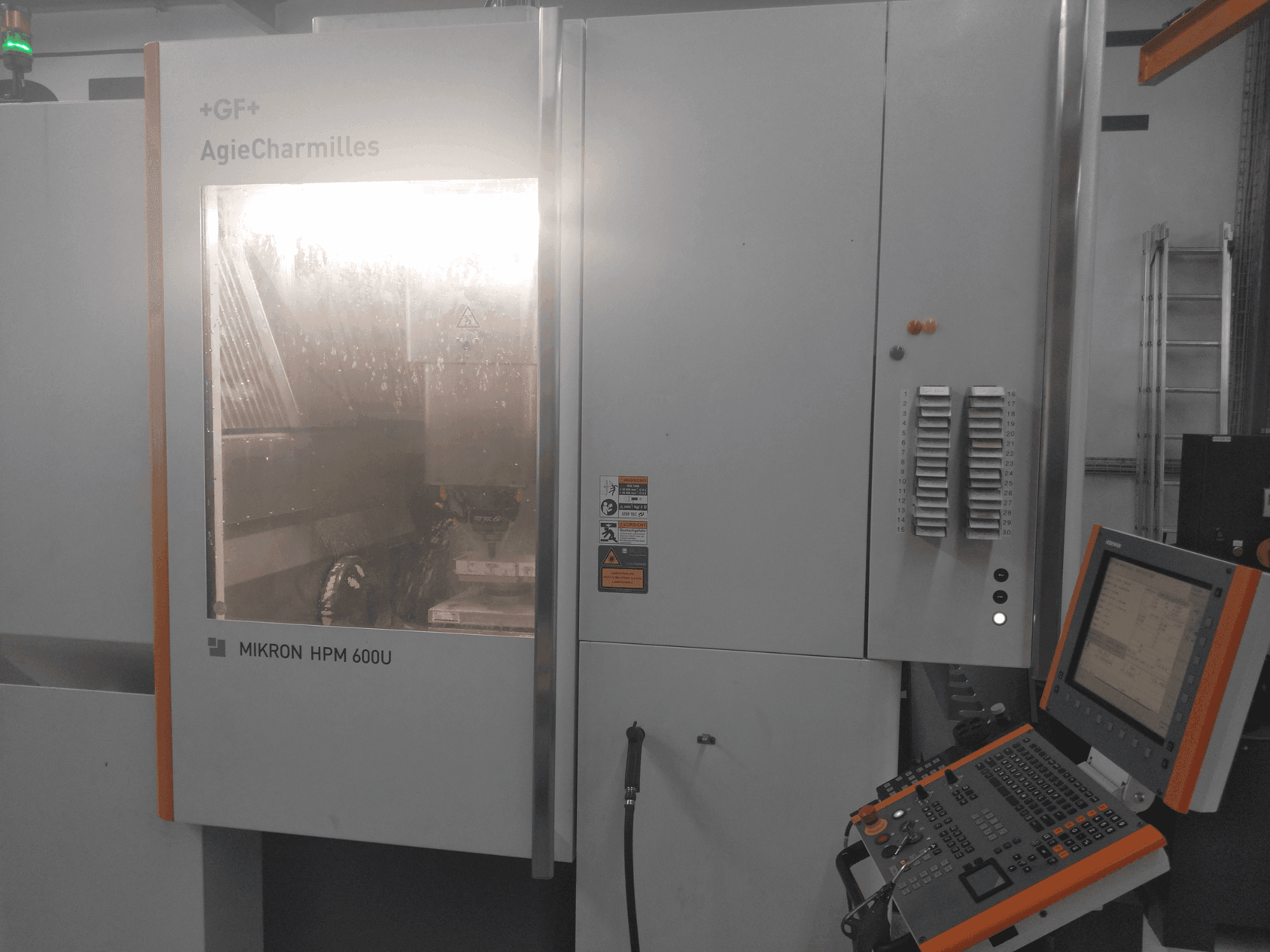 Front view of MIKRON HPM 600U machine