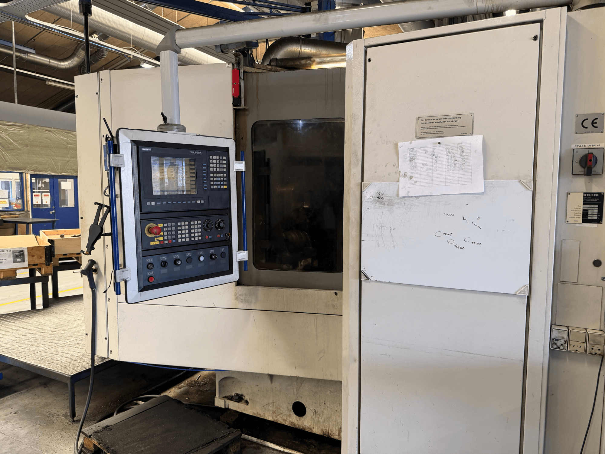 Heller MC 16 horizontal machining center, front view showcasing control panel and operational screen.
