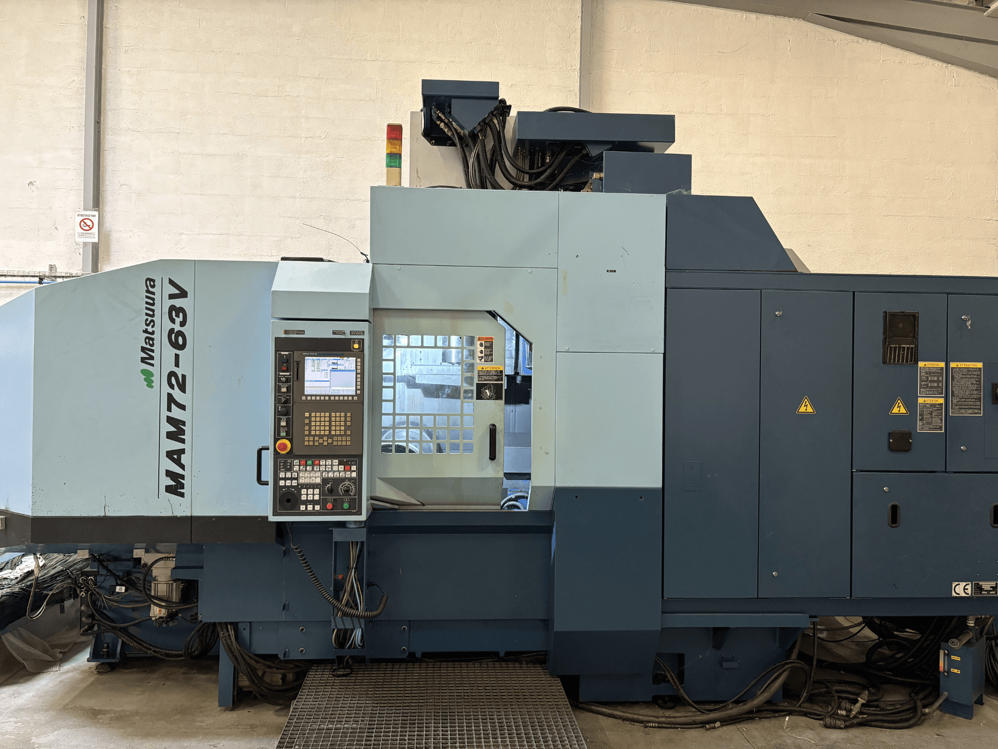Matsuura MAM 72-63 V vertical machining centre, front view showing control panel and safety features.