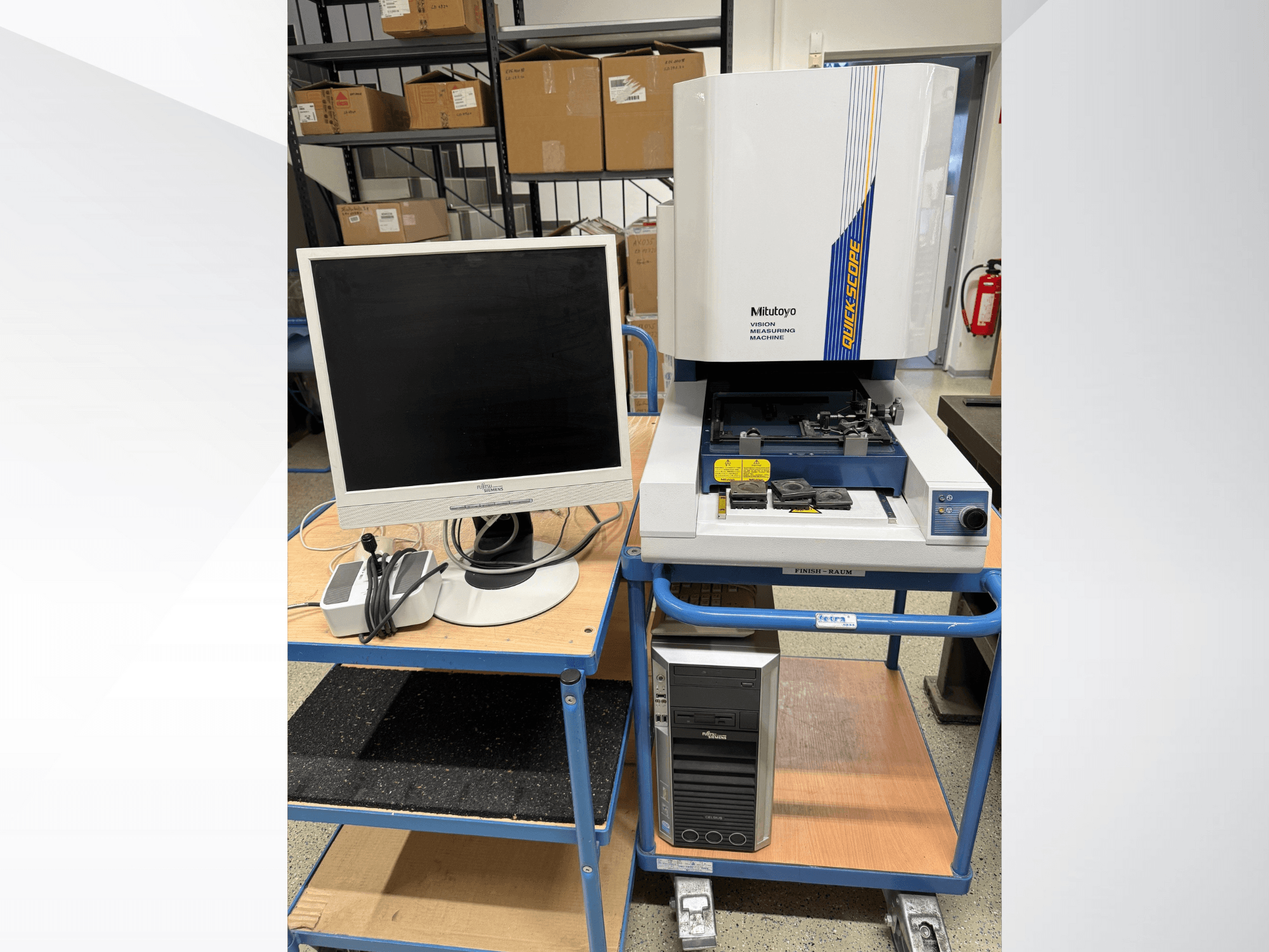 Mitutoyo Quick Scope vision measuring machine with monitor, PC, and accessories, front view, on a blue cart.