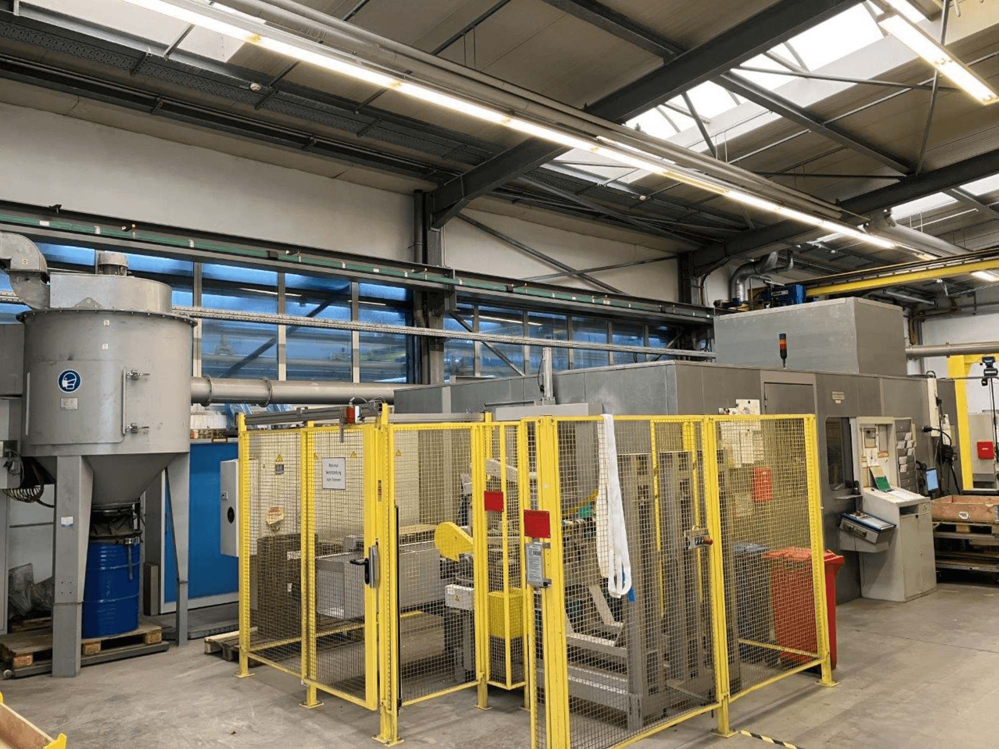 Centerless grinding machine HARALD BAUGMARTEN TM 400 S, front view with safety enclosure and extraction system visible.