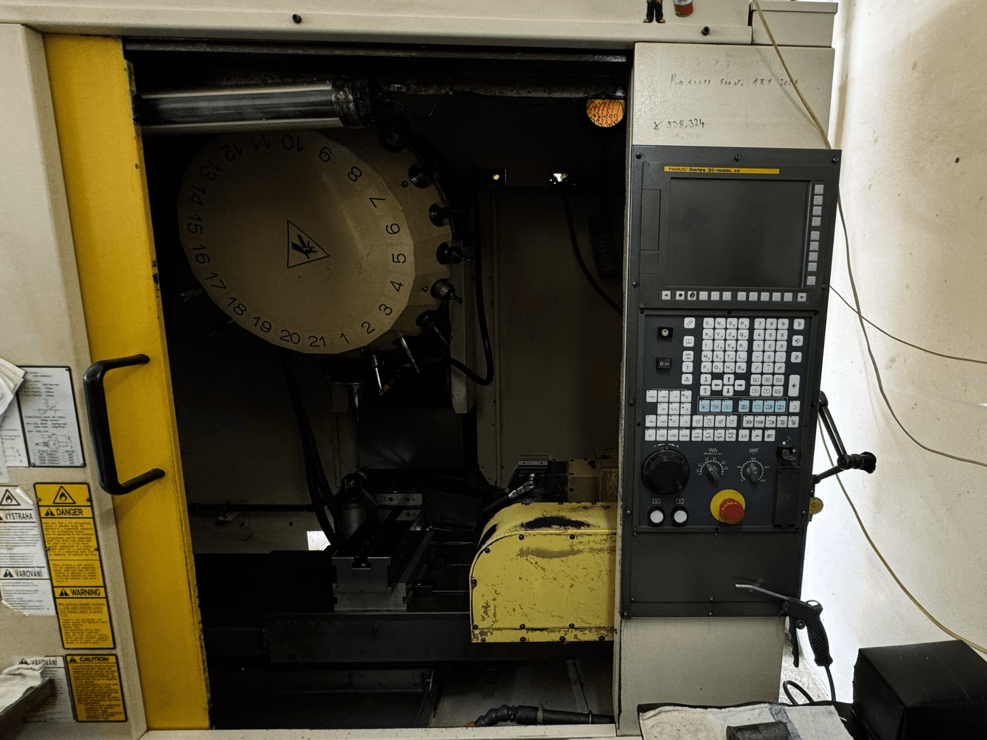 FANUC Robodrill alpha-T21iFL vertical machining center, front view showing control panel and tool magazine.