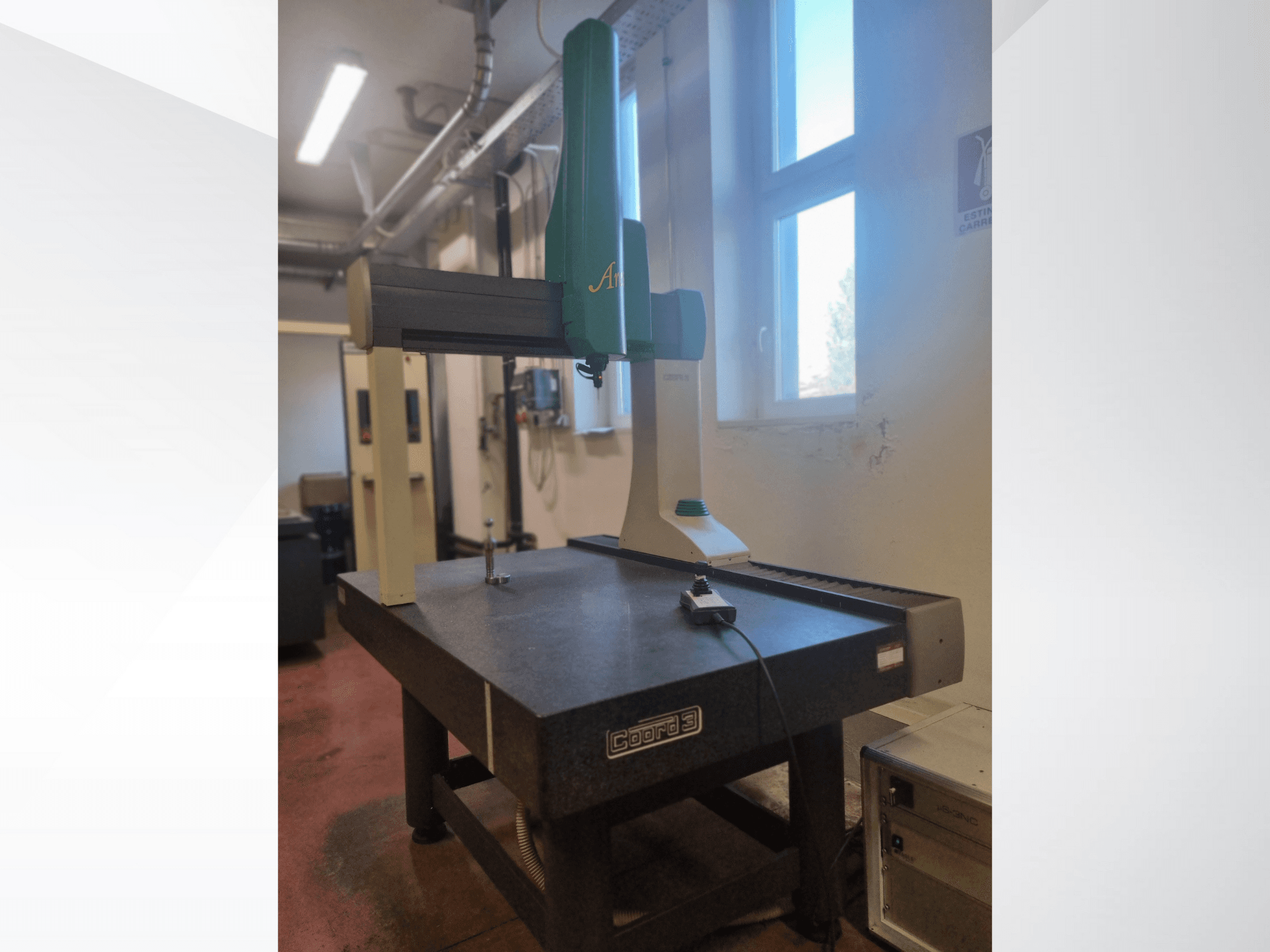 GOM Atos 3D scanner from a front view on a granite measurement table, with visible cable and control device.