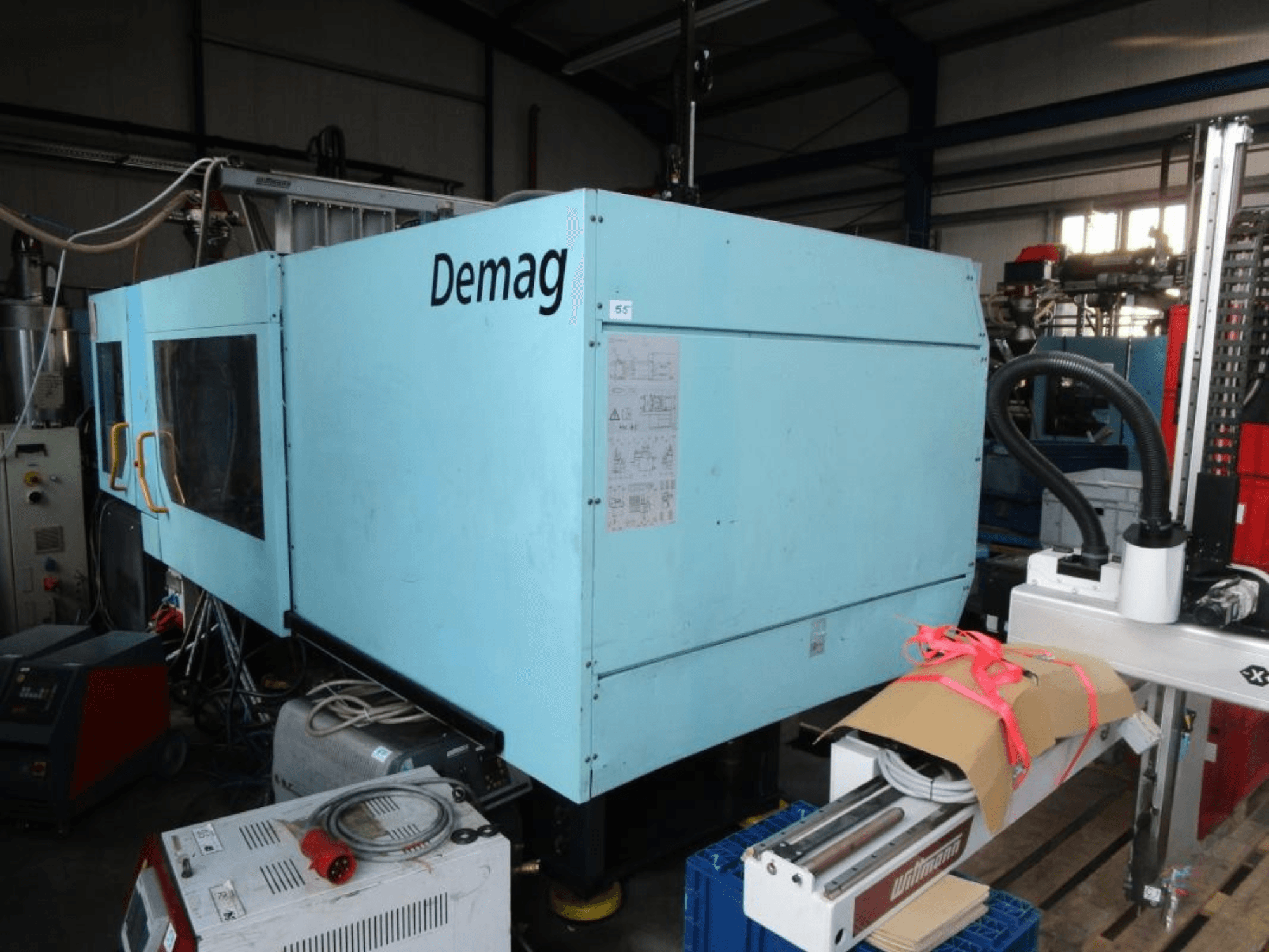 Front view of a DEMAG Ergotech 350/710-2300 hydraulic injection moulding machine, featuring control panel and side details.