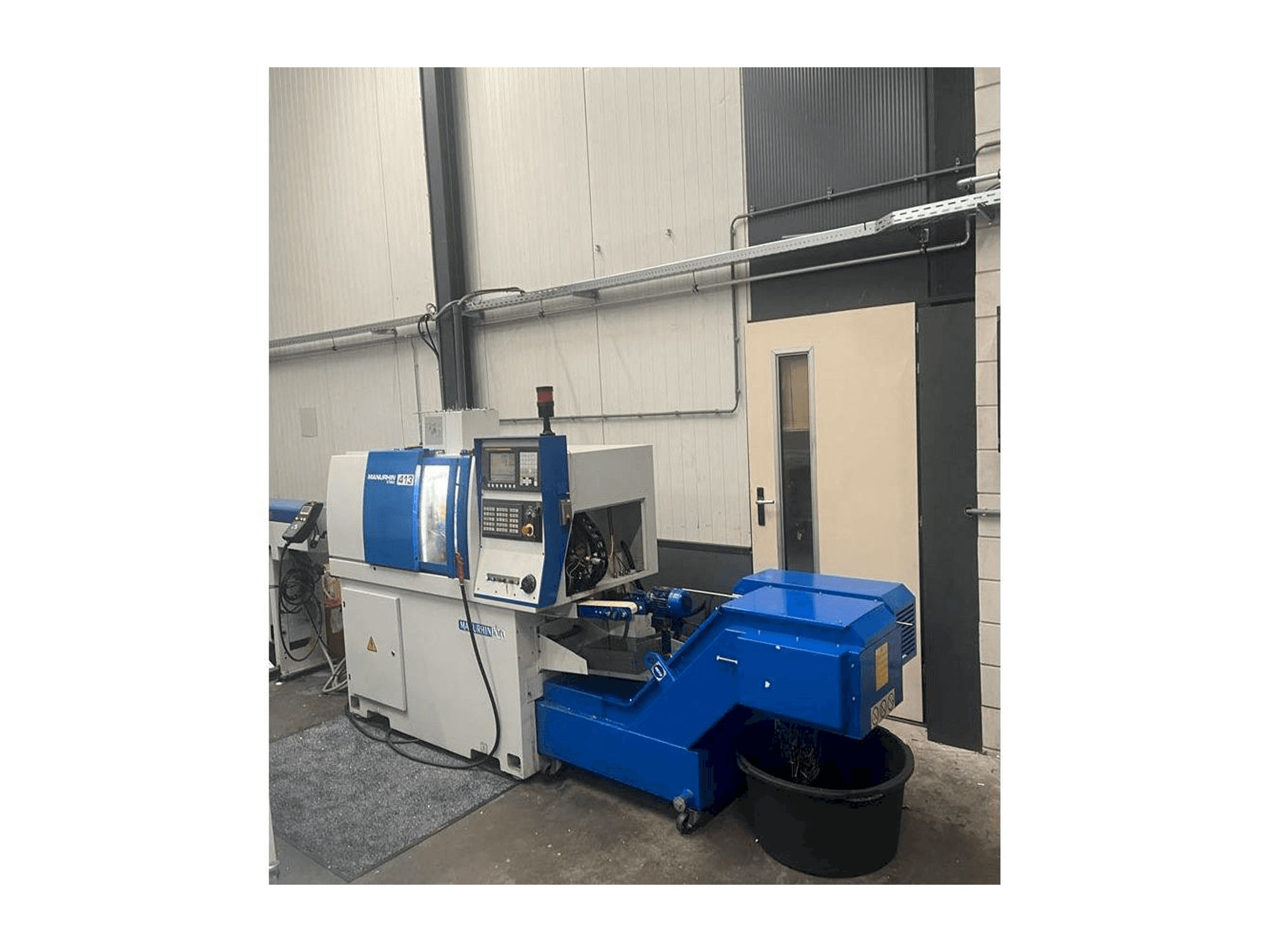 Front view of Manurhin K'MX 413 machine