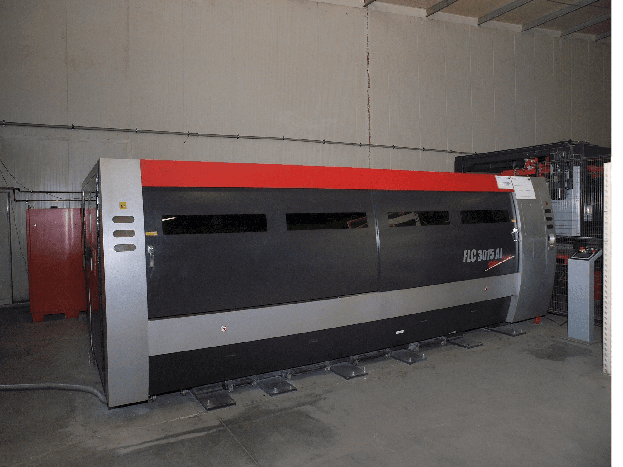 Front view of AMADA LC-3015 AJ 2kW Fiber laser machine