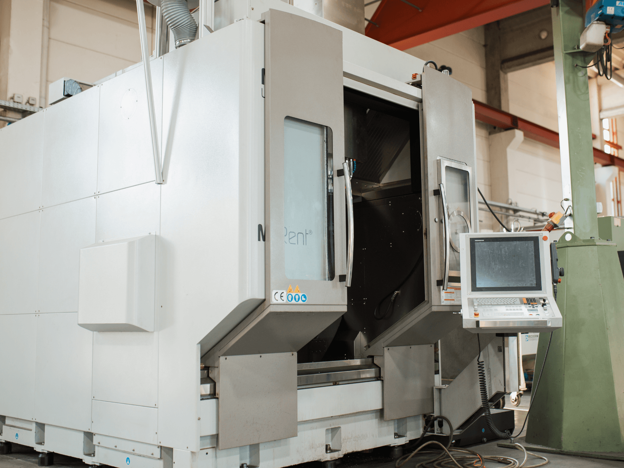 N Rent® CNC milling machine, front view, features a control panel with screen, open doors, and industrial environment.