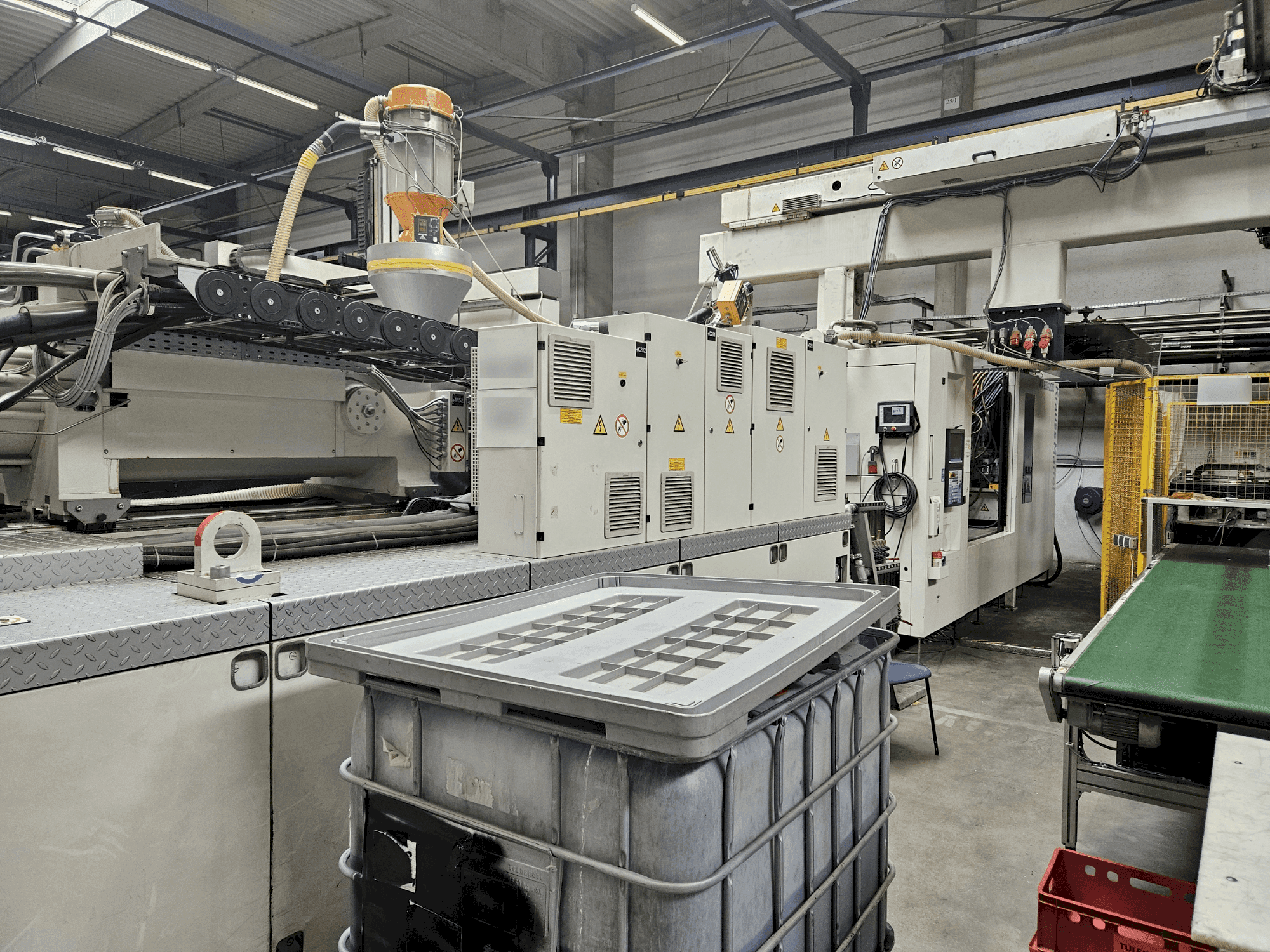 Front view of Krauss Maffei 850-12000 MX machine