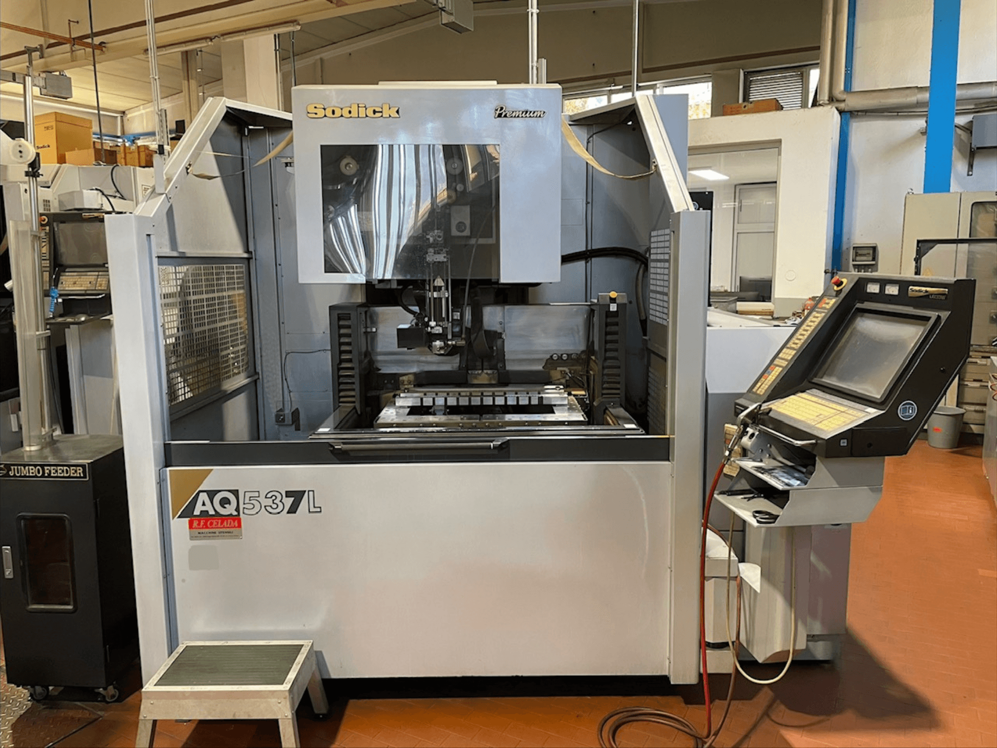 Sodick AQ537L Wire EDM machine in front view, showcasing control panel and machining area with visible components.