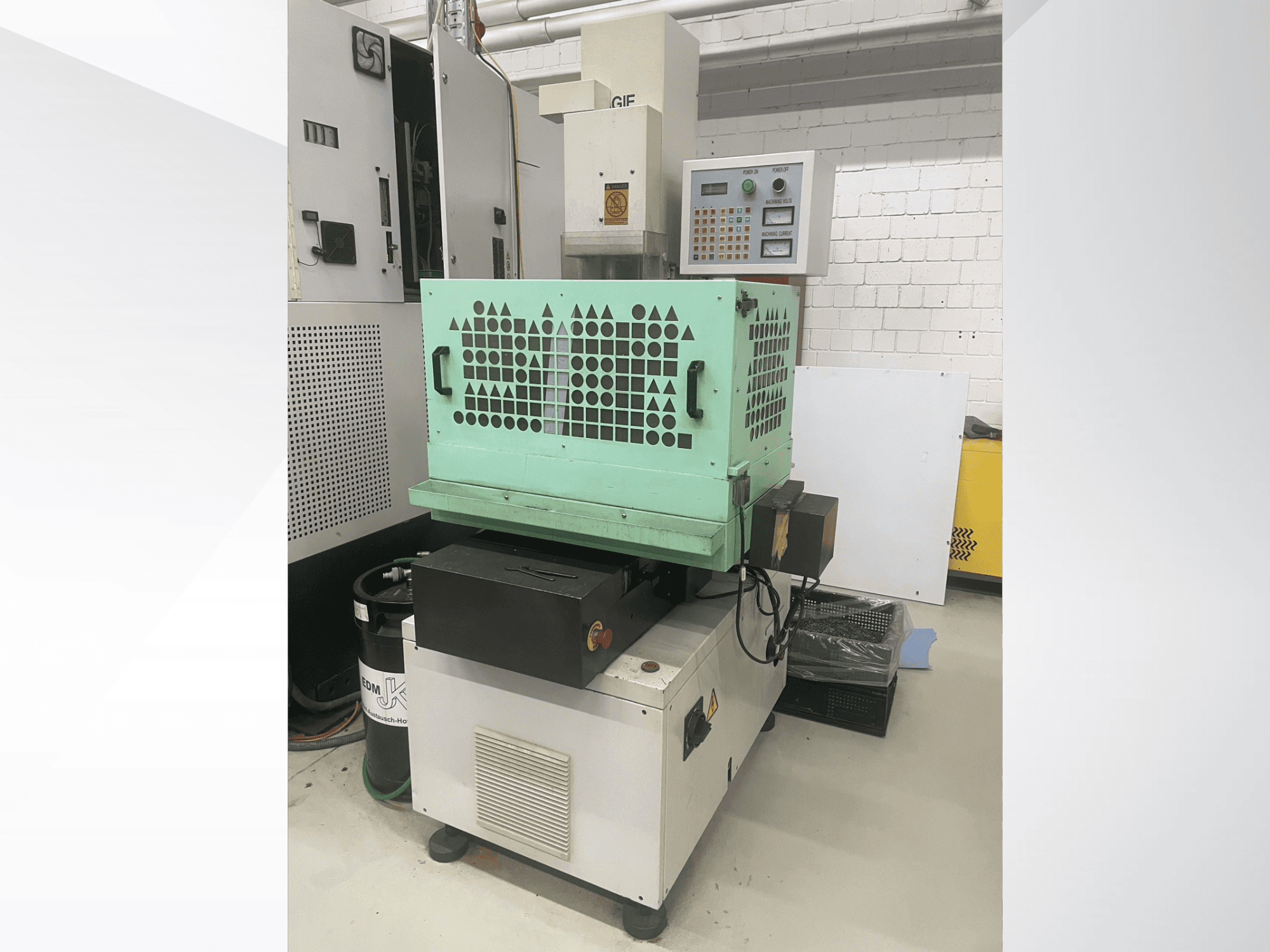 AGIE Drill, metal drilling machine, front view shows controls, green casing, and compact design. Ideal for precision work.