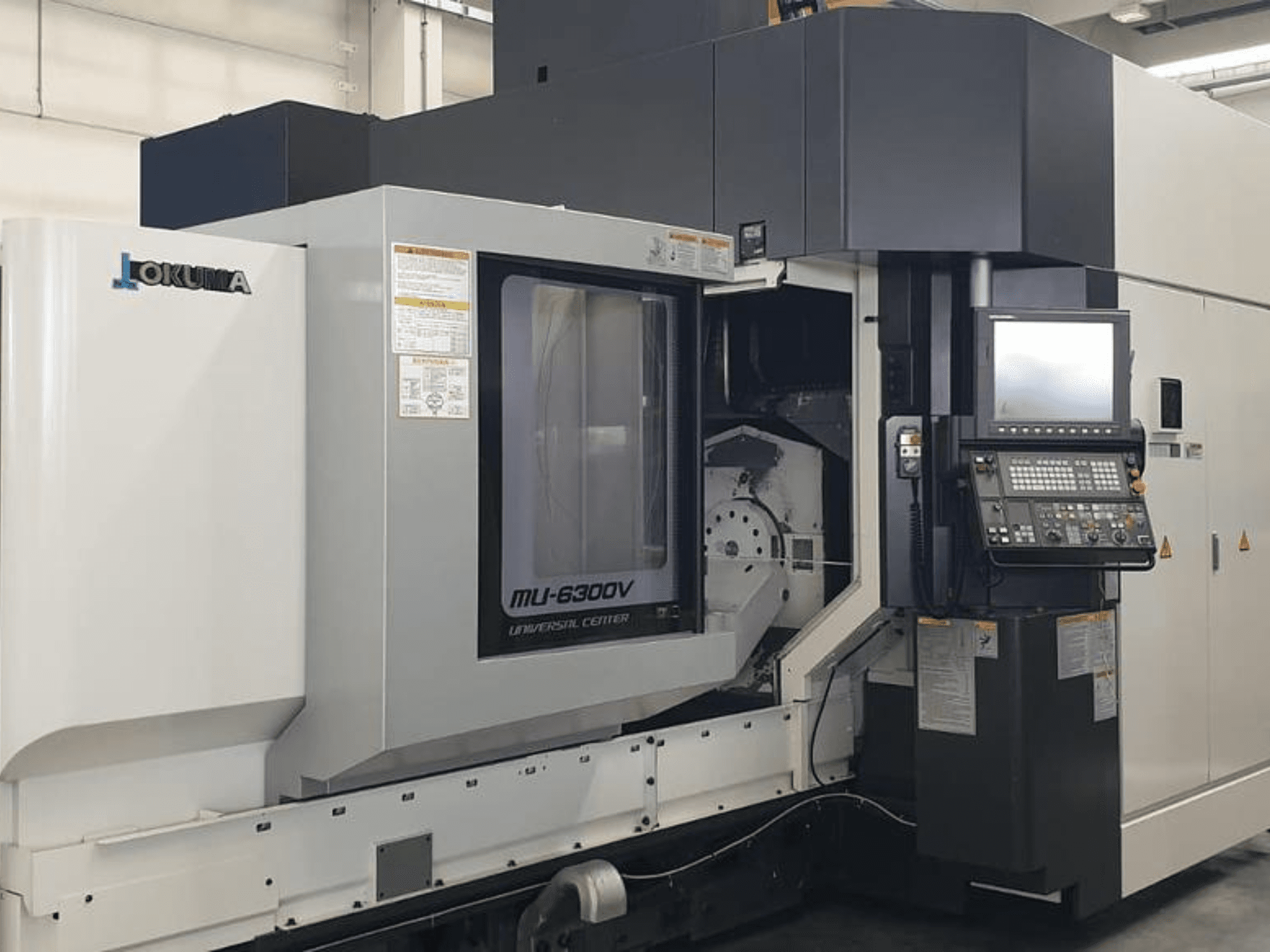 Okuma MU 6300 V Vertical Machining Centre, front view showcasing control panel and machining area details.