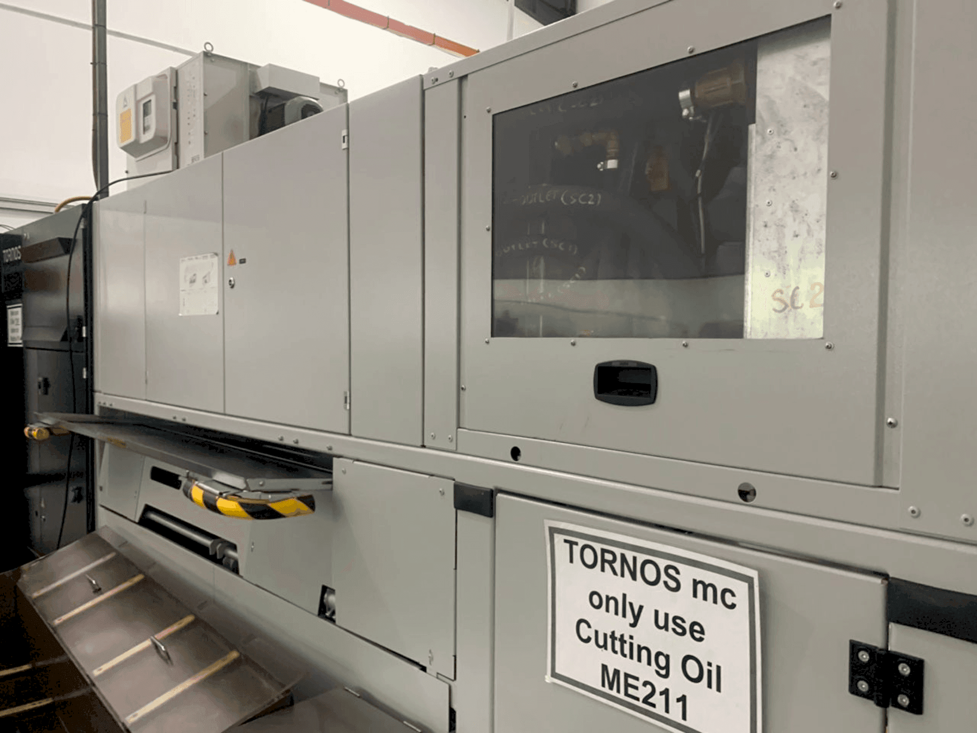 Front view of TORNOS MultiSwiss 6x16 machine