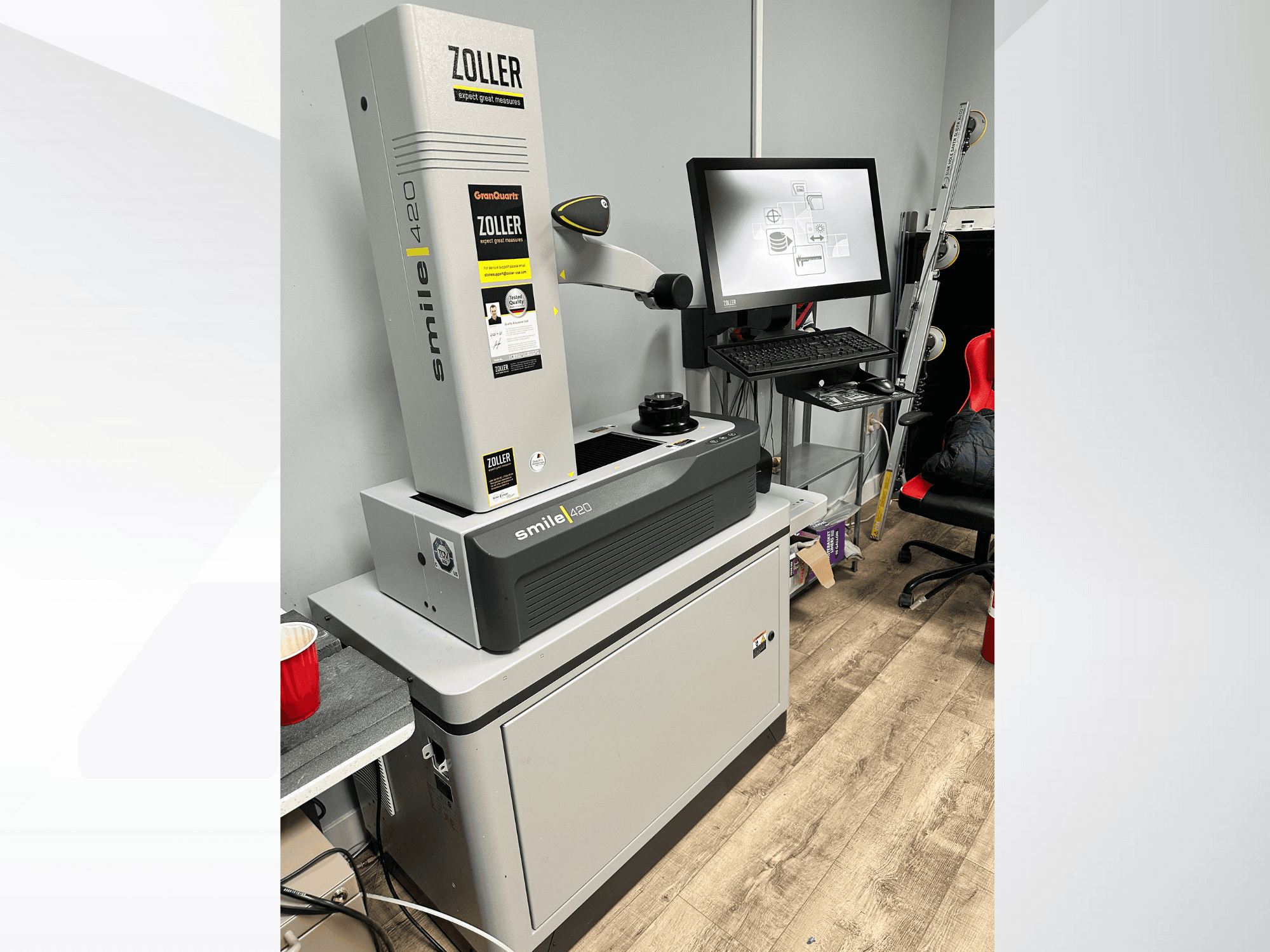 Zoller Smile 420, a digital measuring machine, shown in front view with a monitor and workspace in the background.