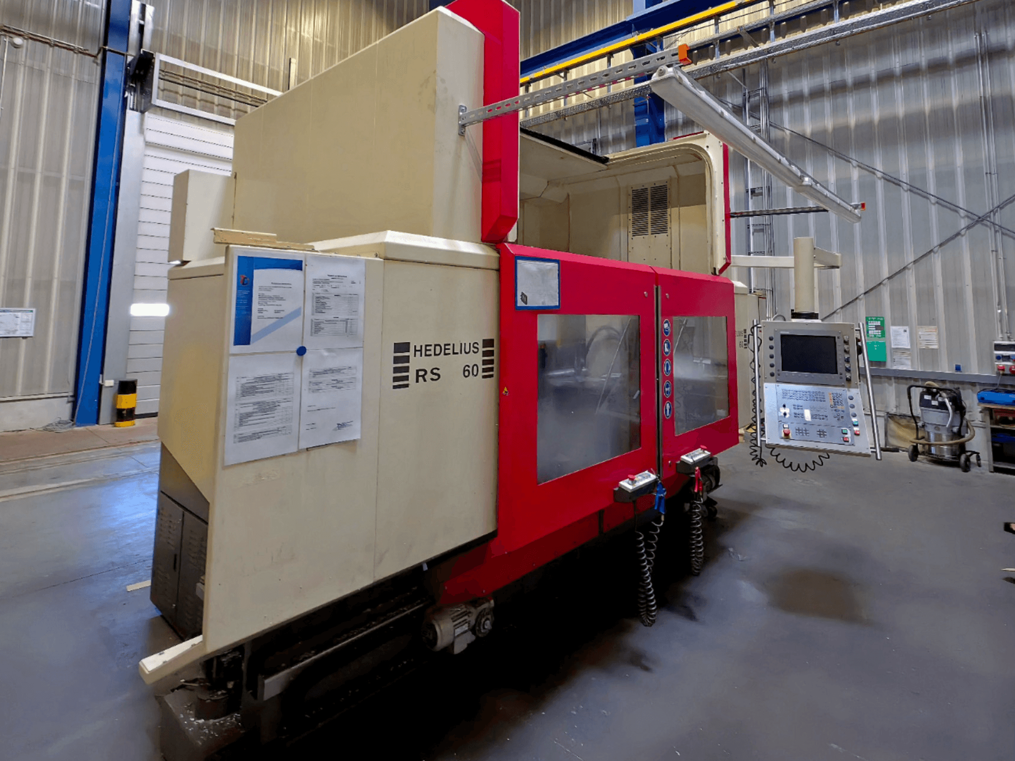 HEDELIUS RS 60 K - 2000 vertical machining centre, side view, features control panel and safety instructions visible.