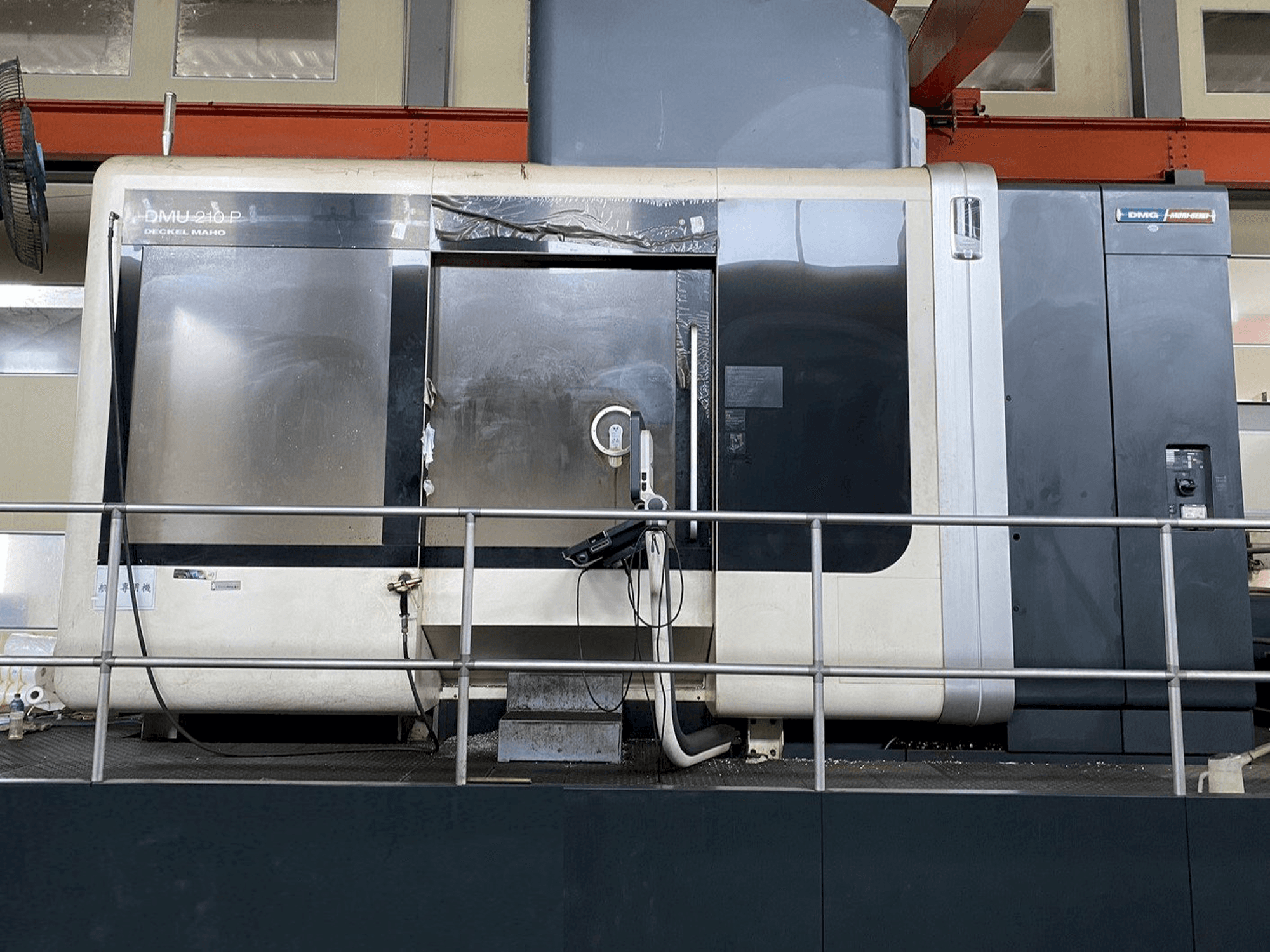 Front view of DMG DMU210P machine