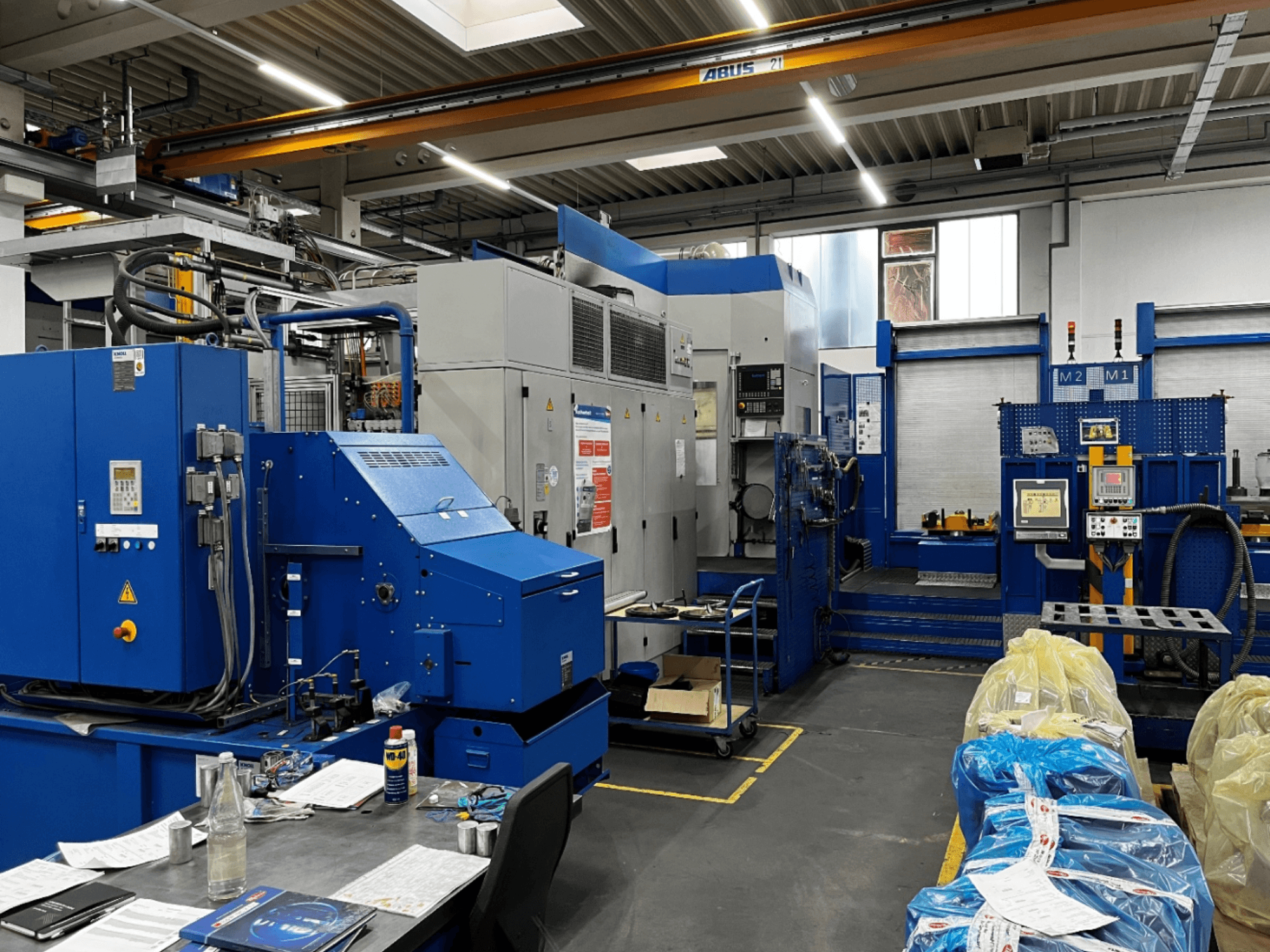 BW MCX750 M1 horizontal machining centre, front view showing control panel and work area with tools and materials.