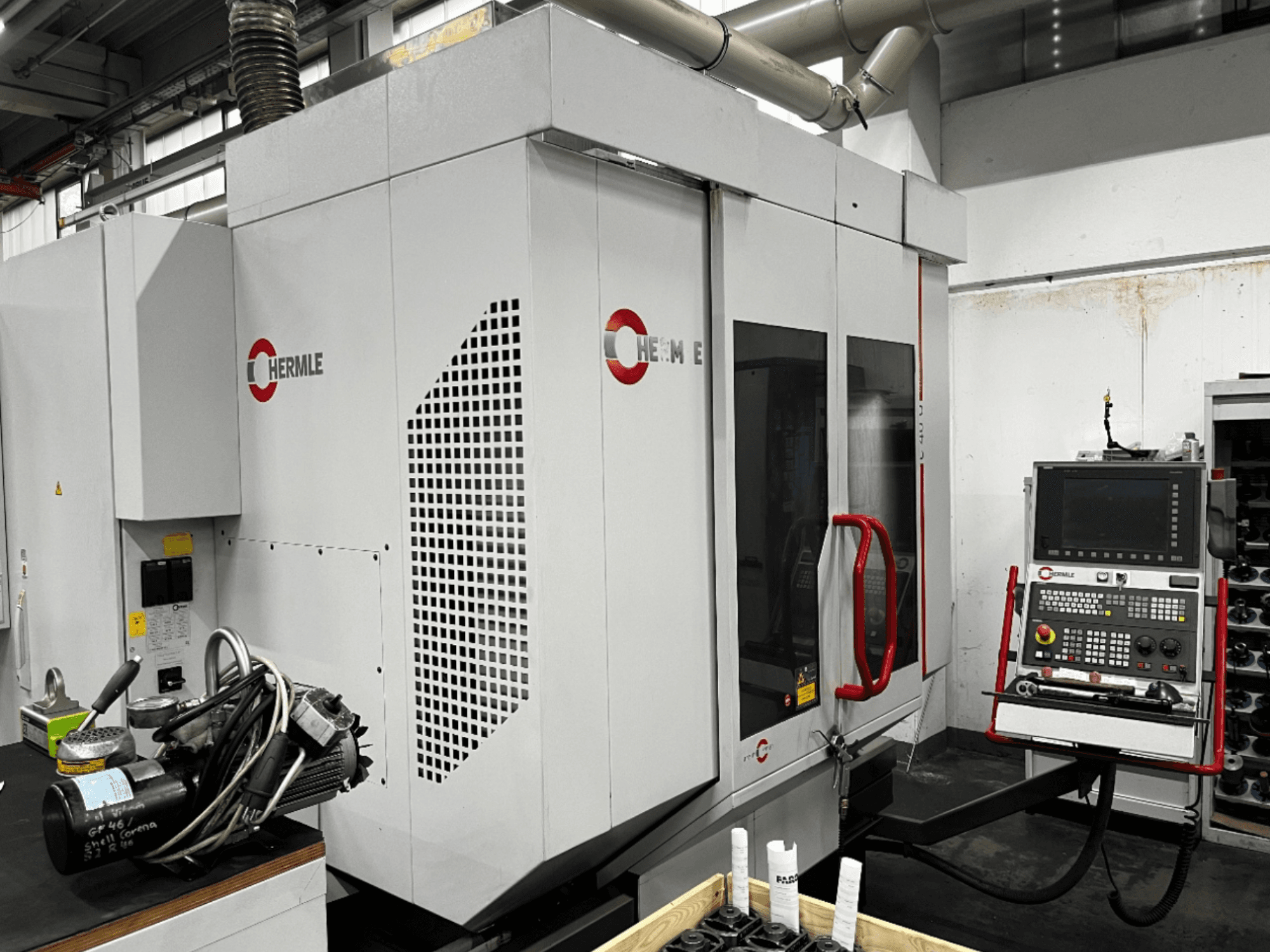 HERMLE C40U universal machining centre in a workshop, front view, showing control panel and detailed machine design.
