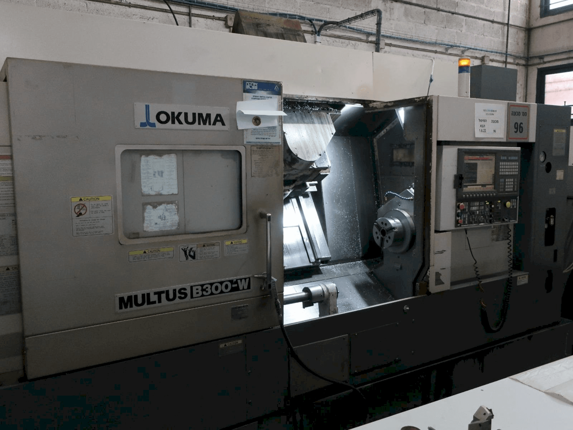Front view of Okuma MULTUS B300-W machine