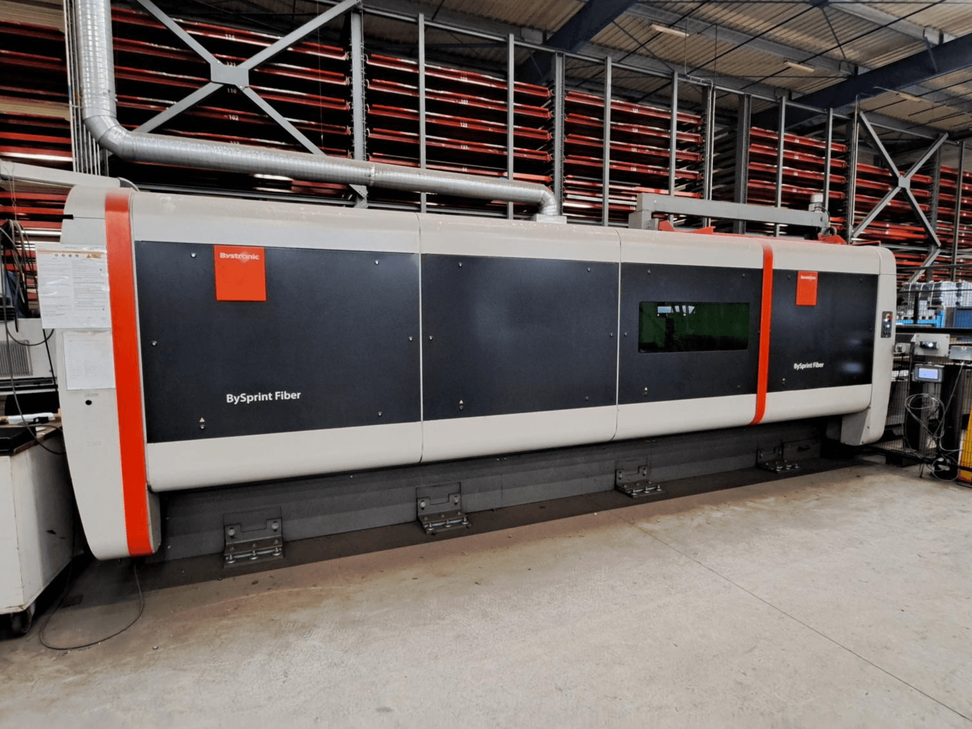 Bystronic BySprint Fiber 4020 fiber laser cutting machine, front view in a workshop setting with safety features visible.