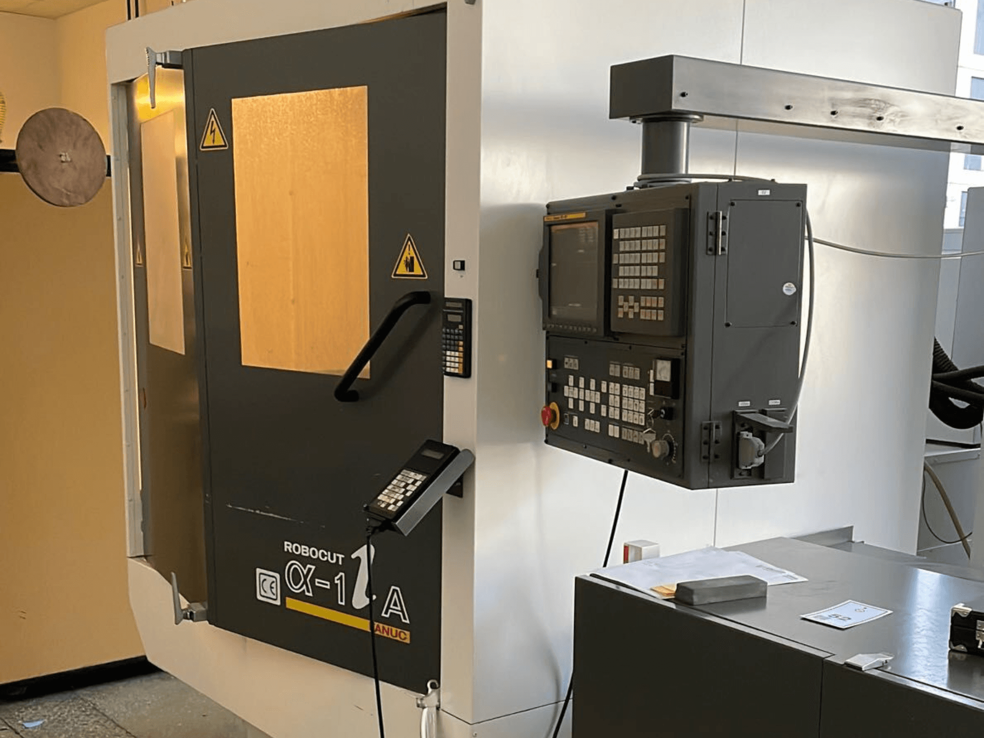 Robocut CX-1 A machine with control panel; front view showcasing safety doors and operation interface.