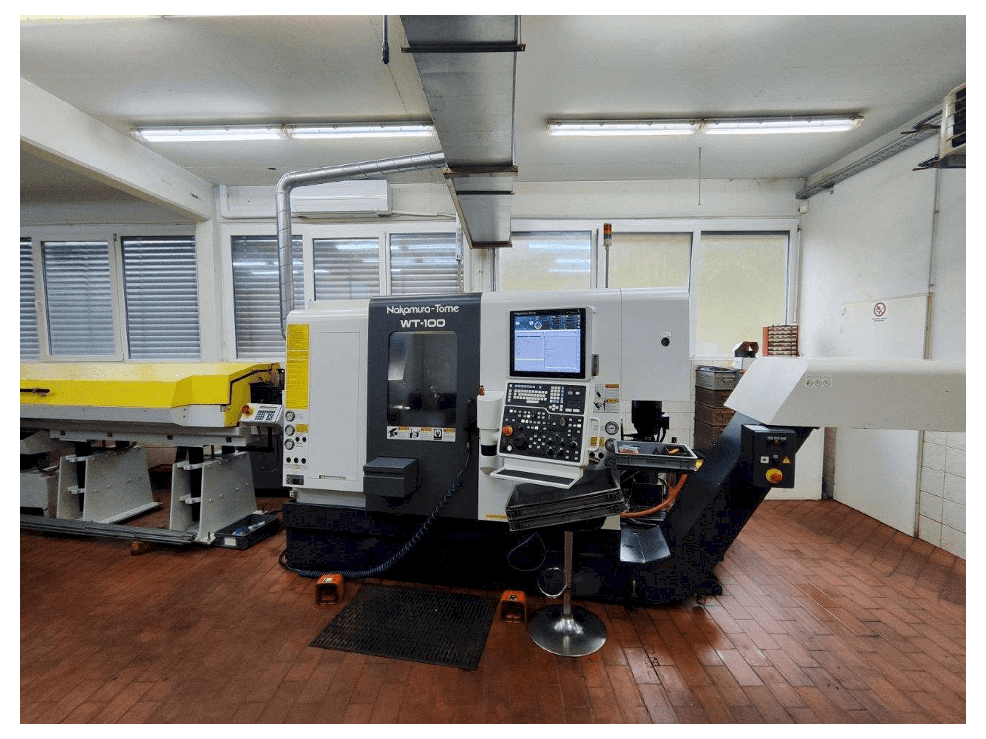 Front view of NAKAMURA-TOME WT-100 MMY machine