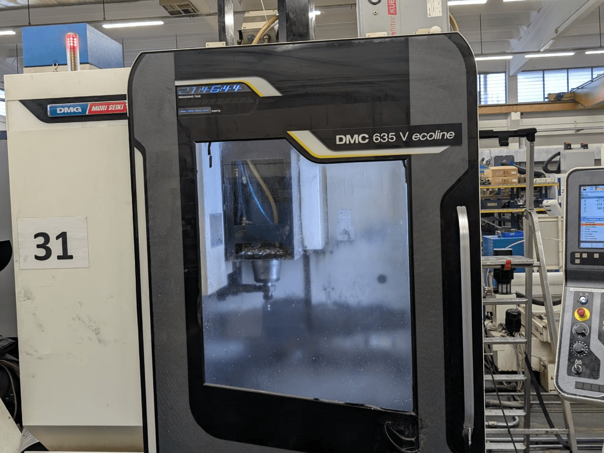 DMG Mori Seiki DMC 635V ecoline vertical machining center, front view showcasing control panel and visible machining area.