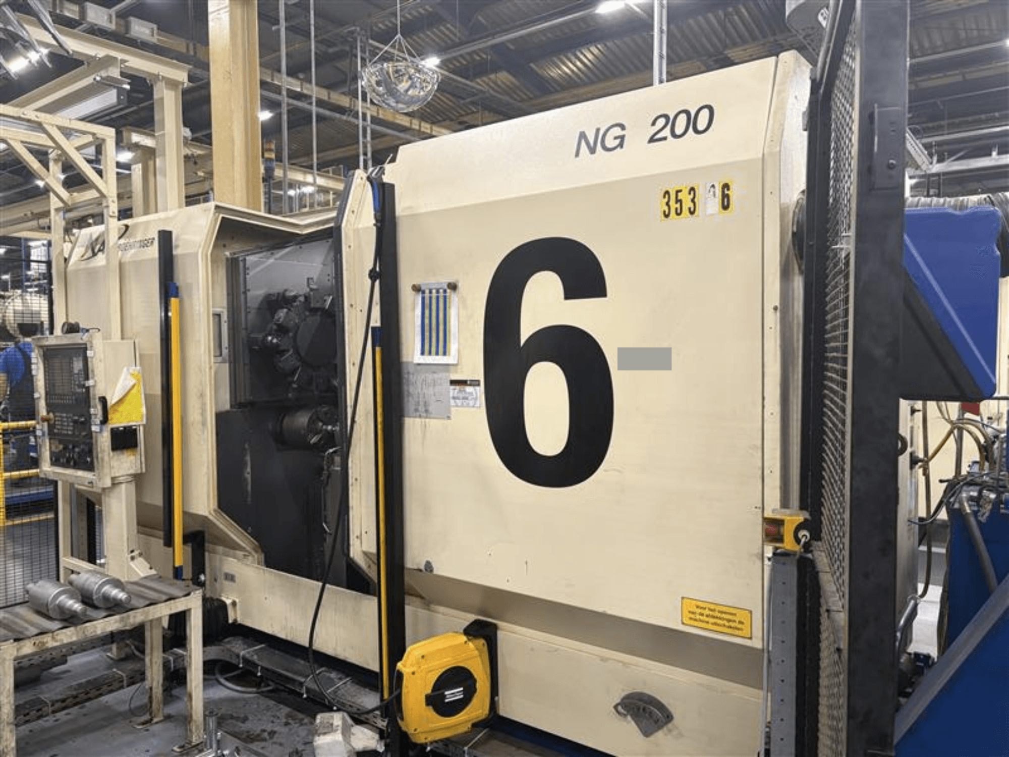 Front view of BOEHRINGER NG-200 horizontal turning machine with large numbers and control panel visible, in a factory setting.