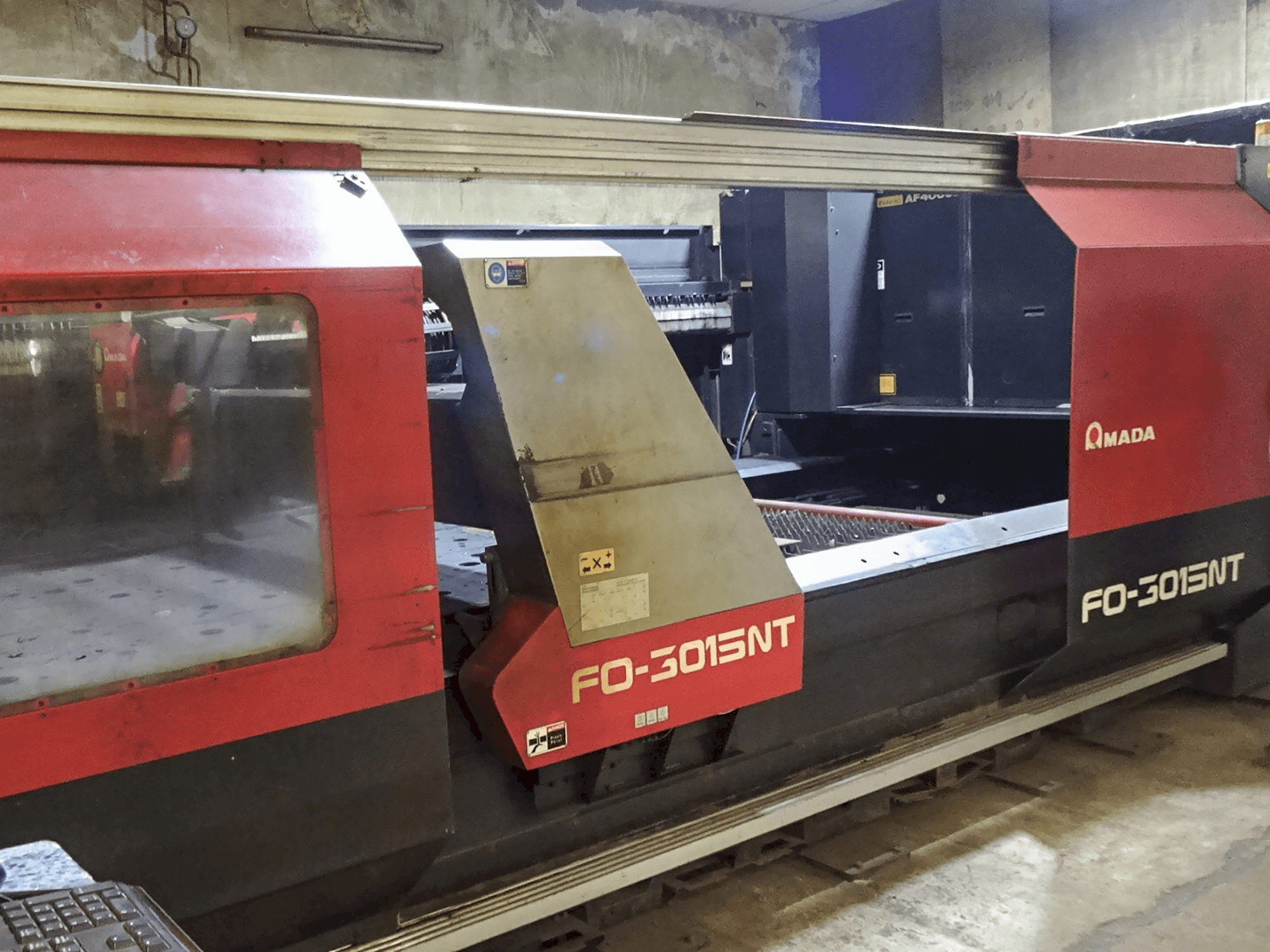 Left view of AMADA F03015NT Machine