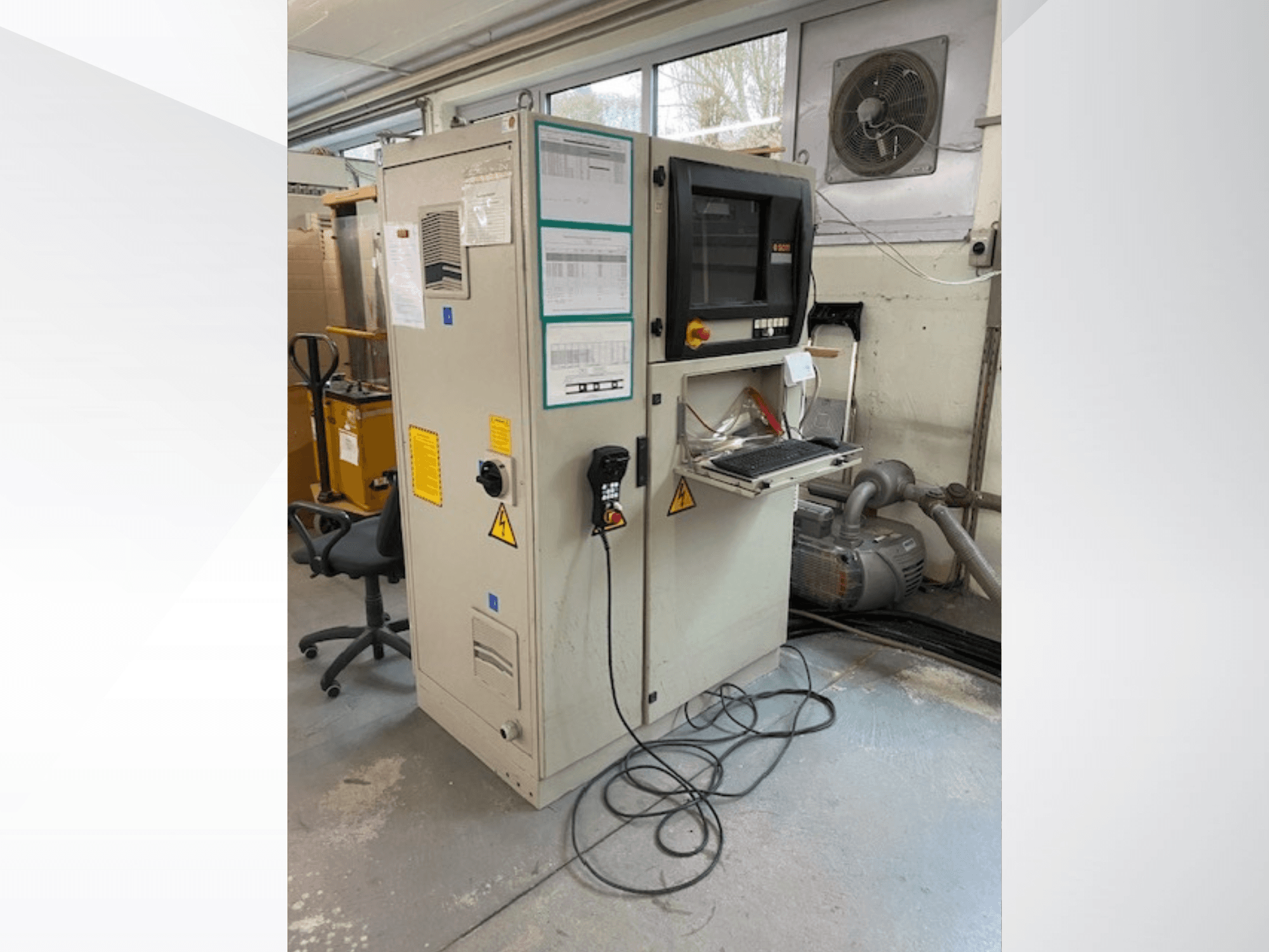 SCM Record 240 CNC wood machining centre in side view, featuring a control panel, safety labels, and connected to a motor.