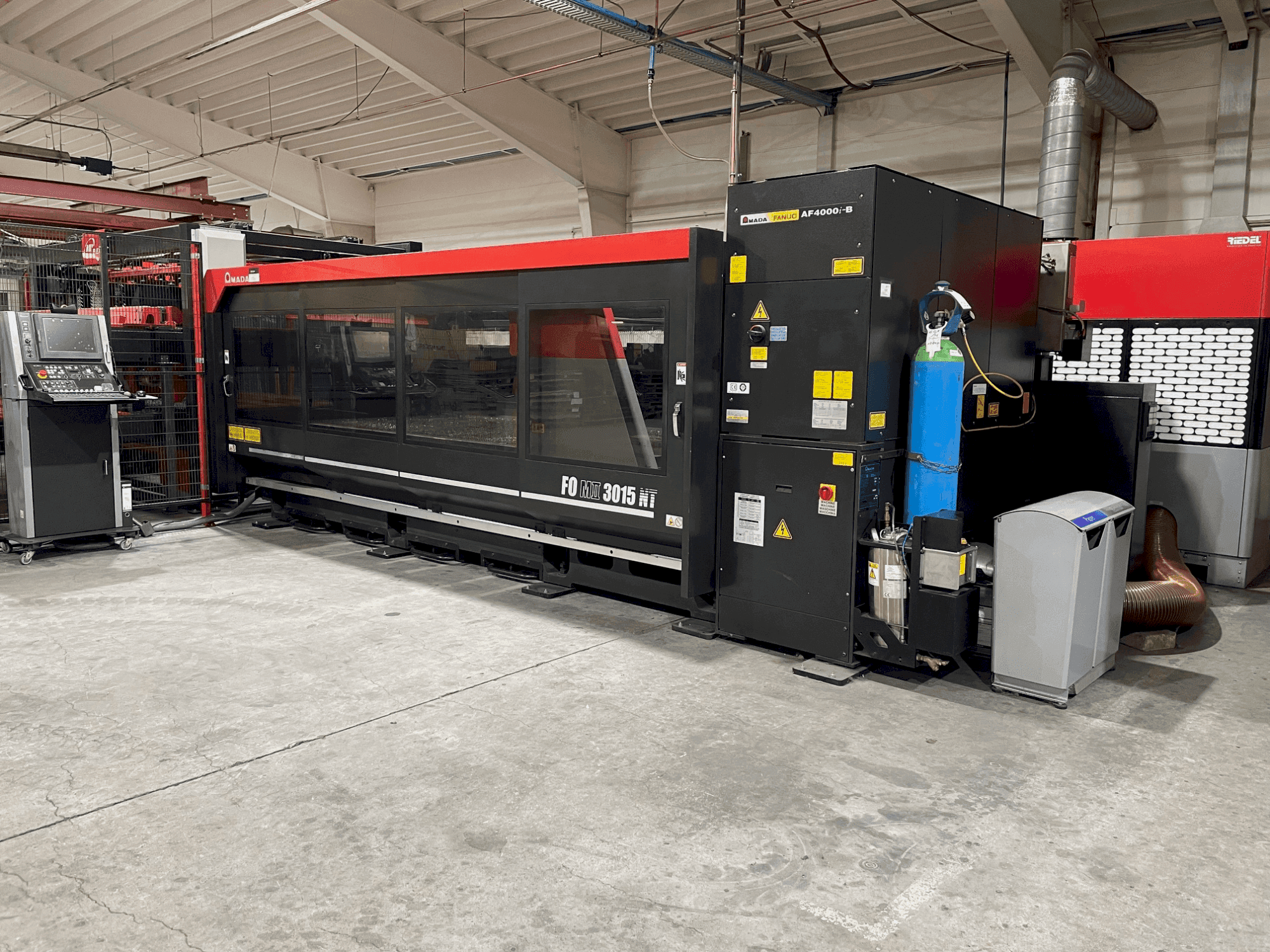 Front view of AMADA FOM2 3015 NT machine